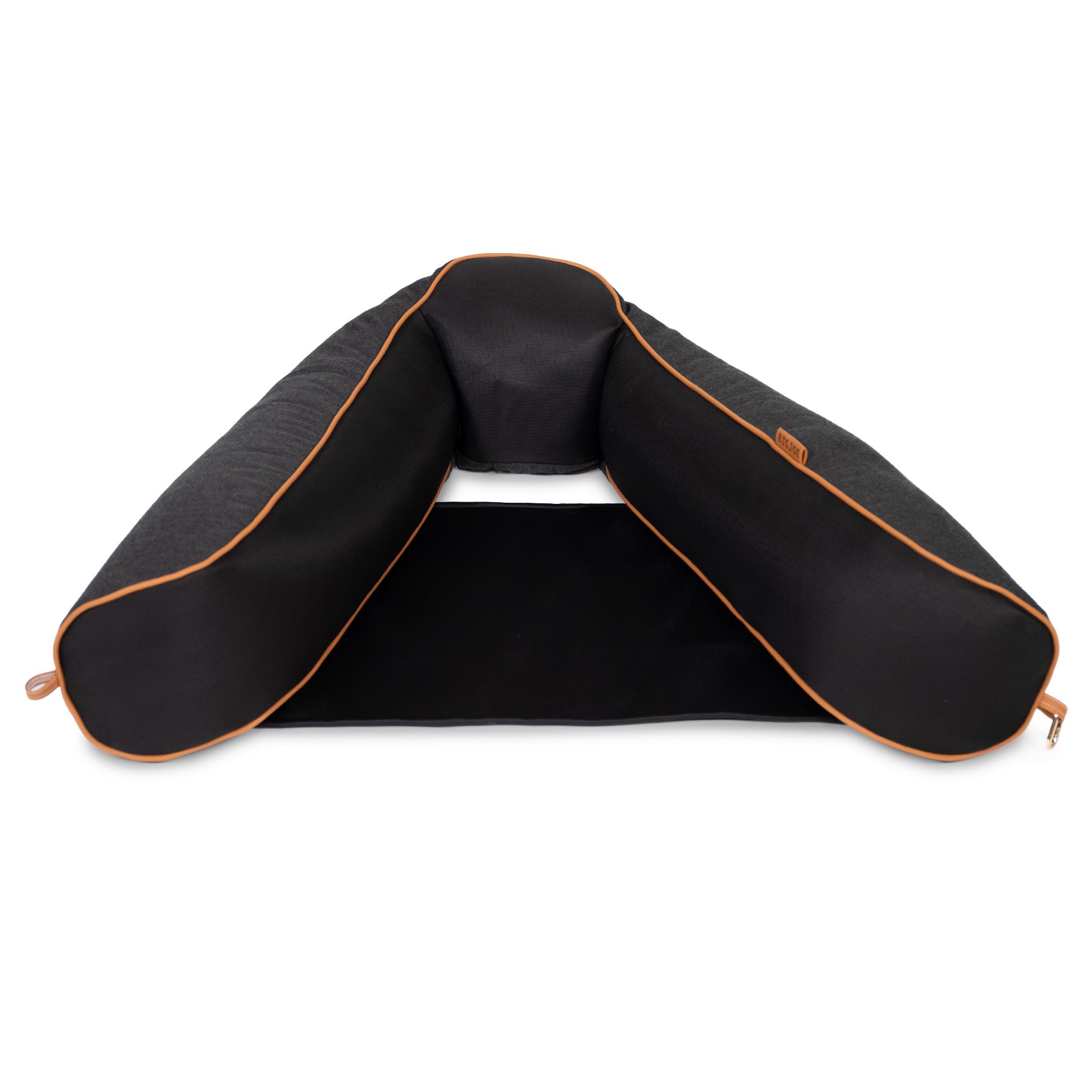 Black travel pillow with orange accents on a white background