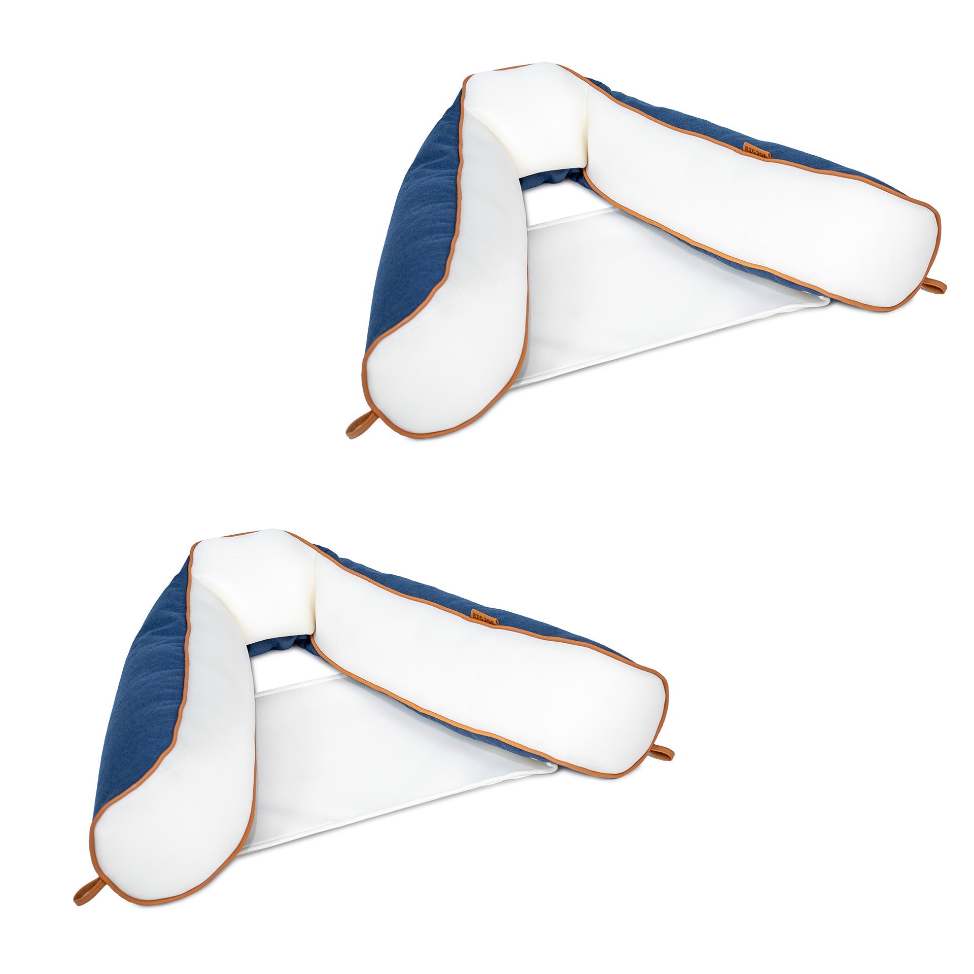 Two blue and white pillows with brown accents on a white background