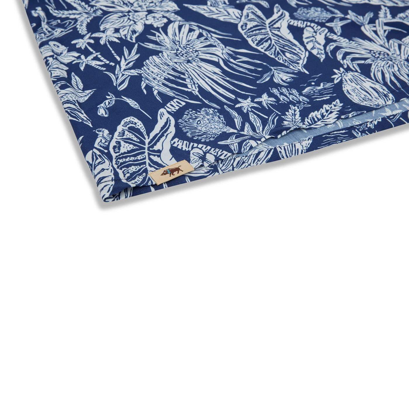 Blue fabric with white floral pattern on a white background