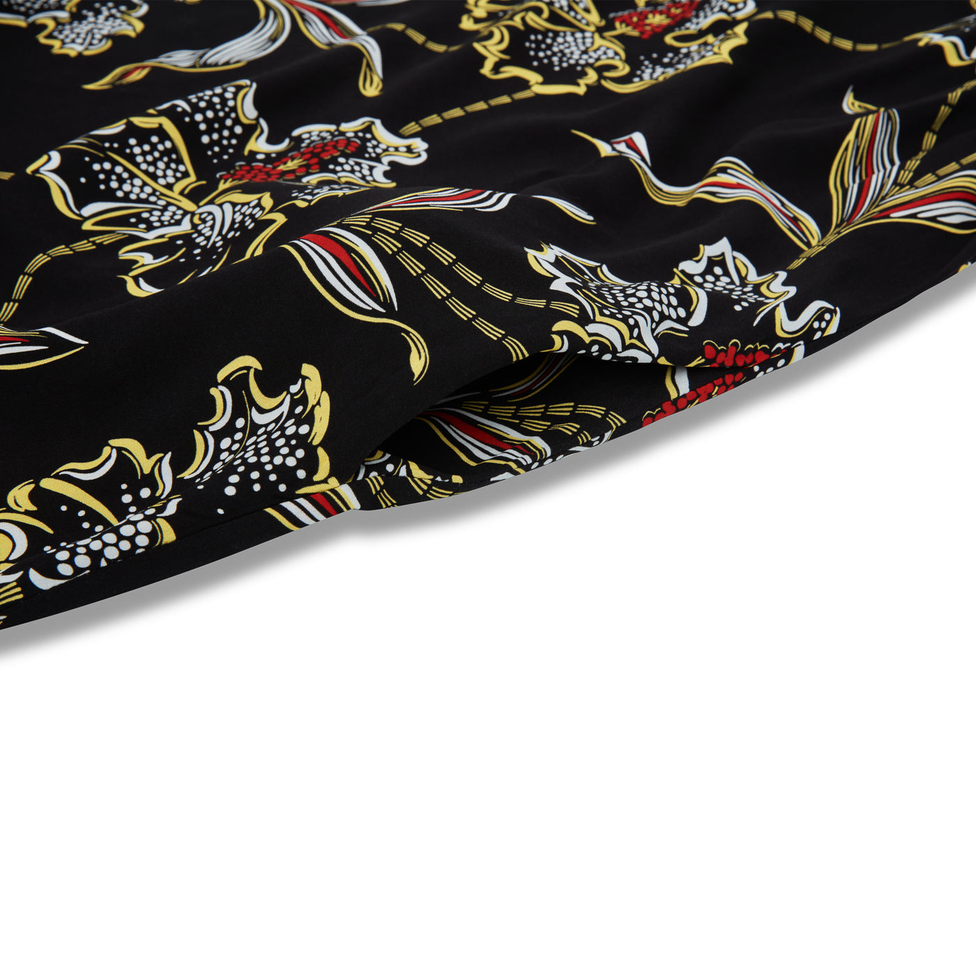 Close-up of patterned fabric with dragons on a black background
