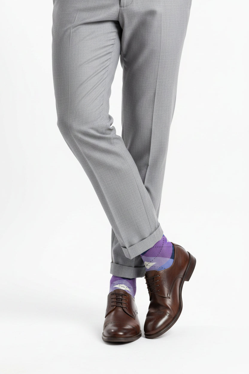 Purple and blue argyle patterned sock on a white background
