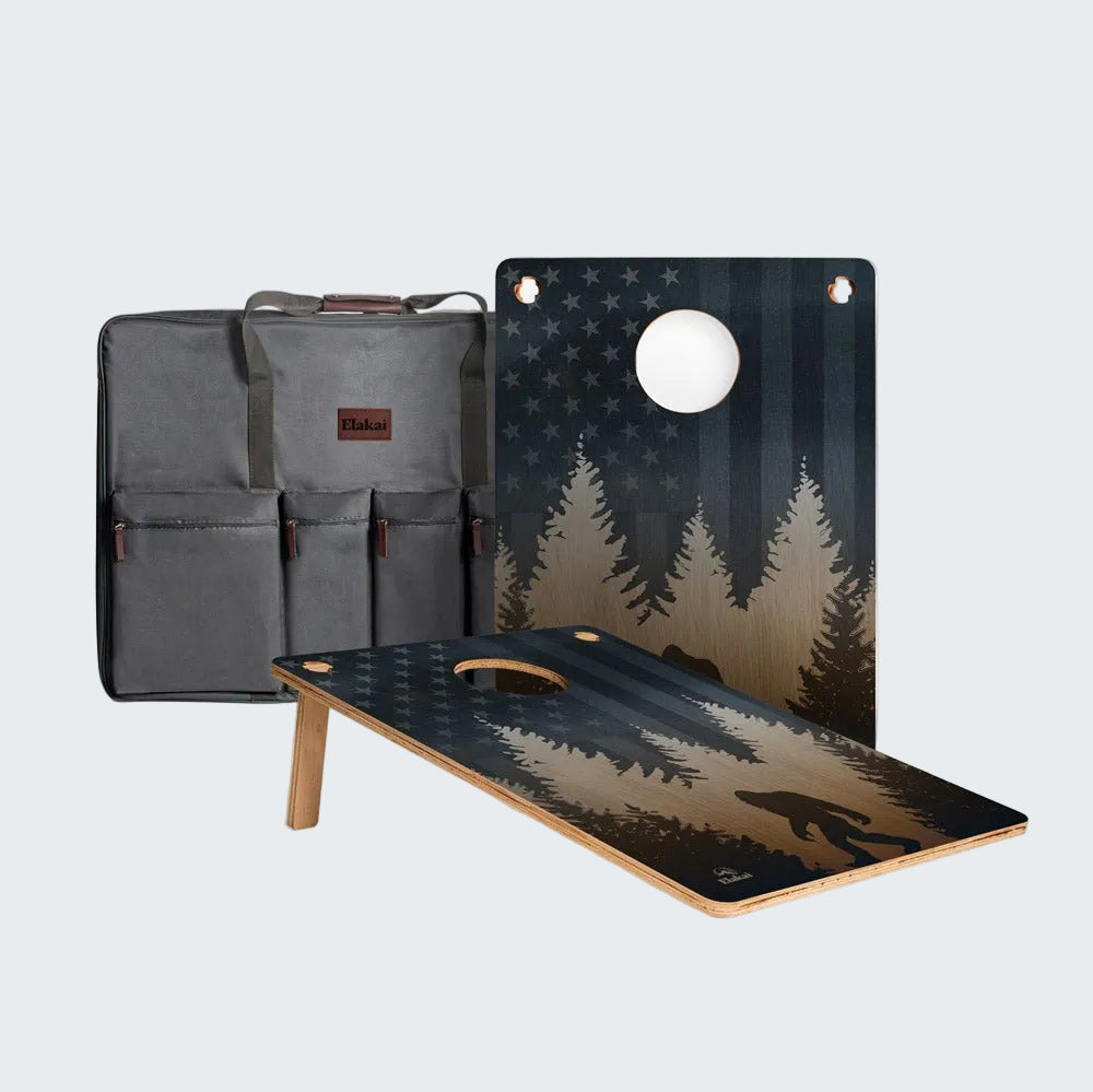 Outdoor game set with bean bag toss boards and carrying case on a white background
