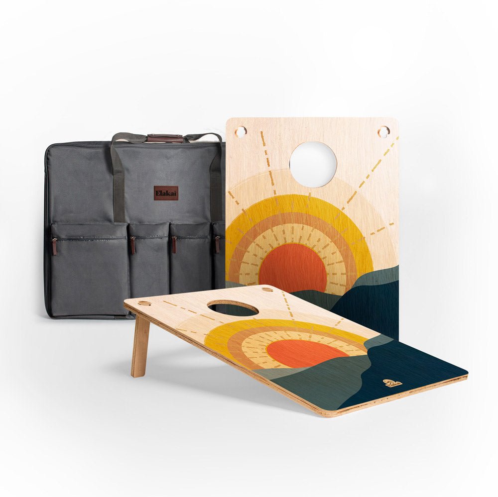 Two wooden boards with artistic designs and a gray bag on a white background