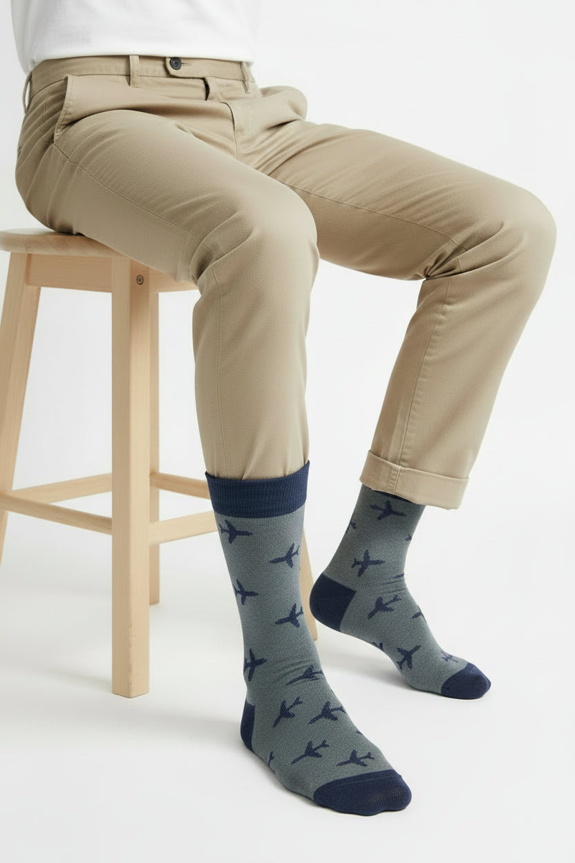 Gray sock with airplane pattern on a white background