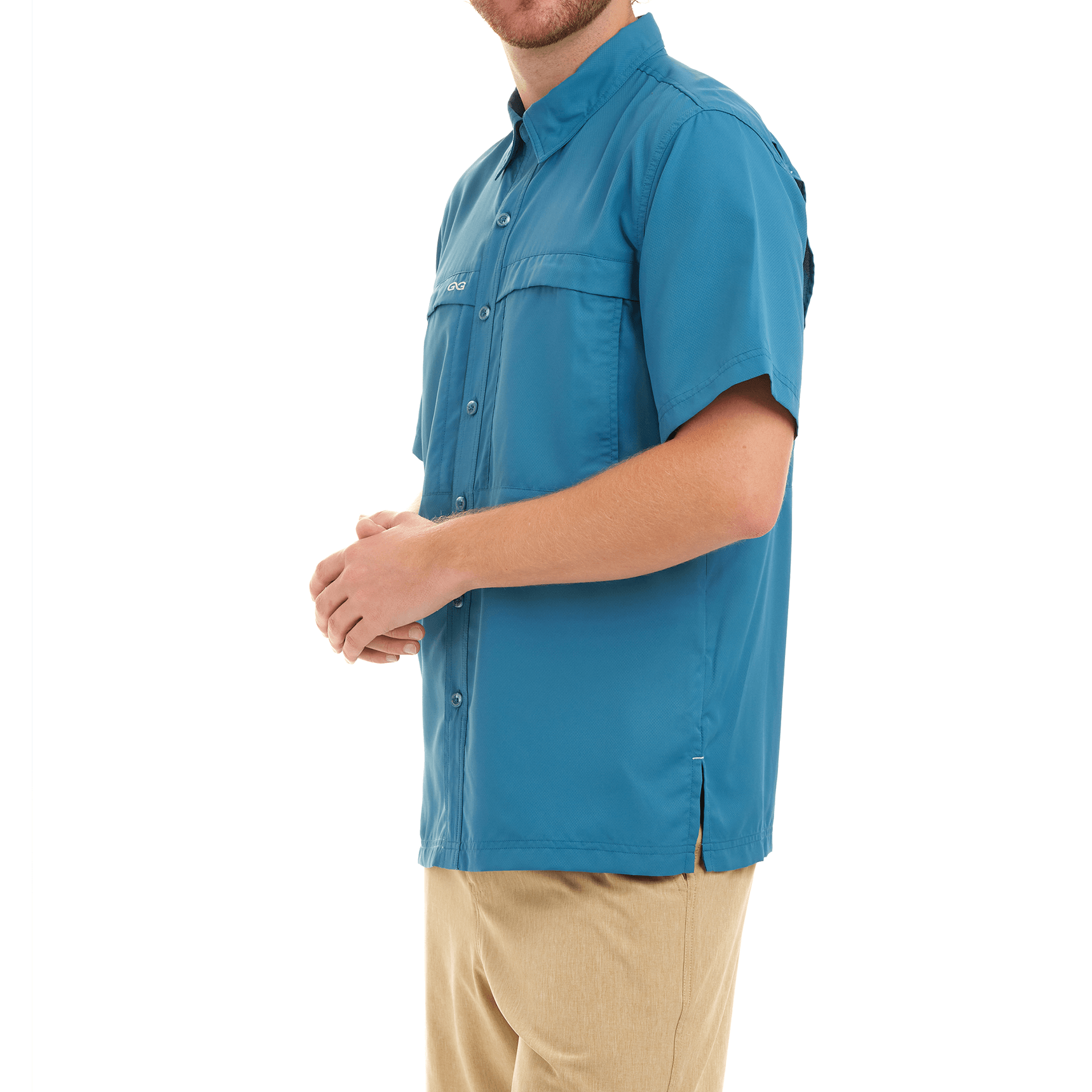 Man wearing a blue shirt with a visible brand logo on a white background