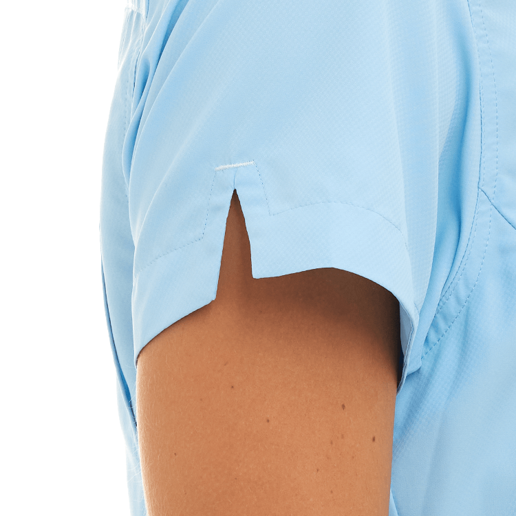 Light blue shirt with a small button on a white background