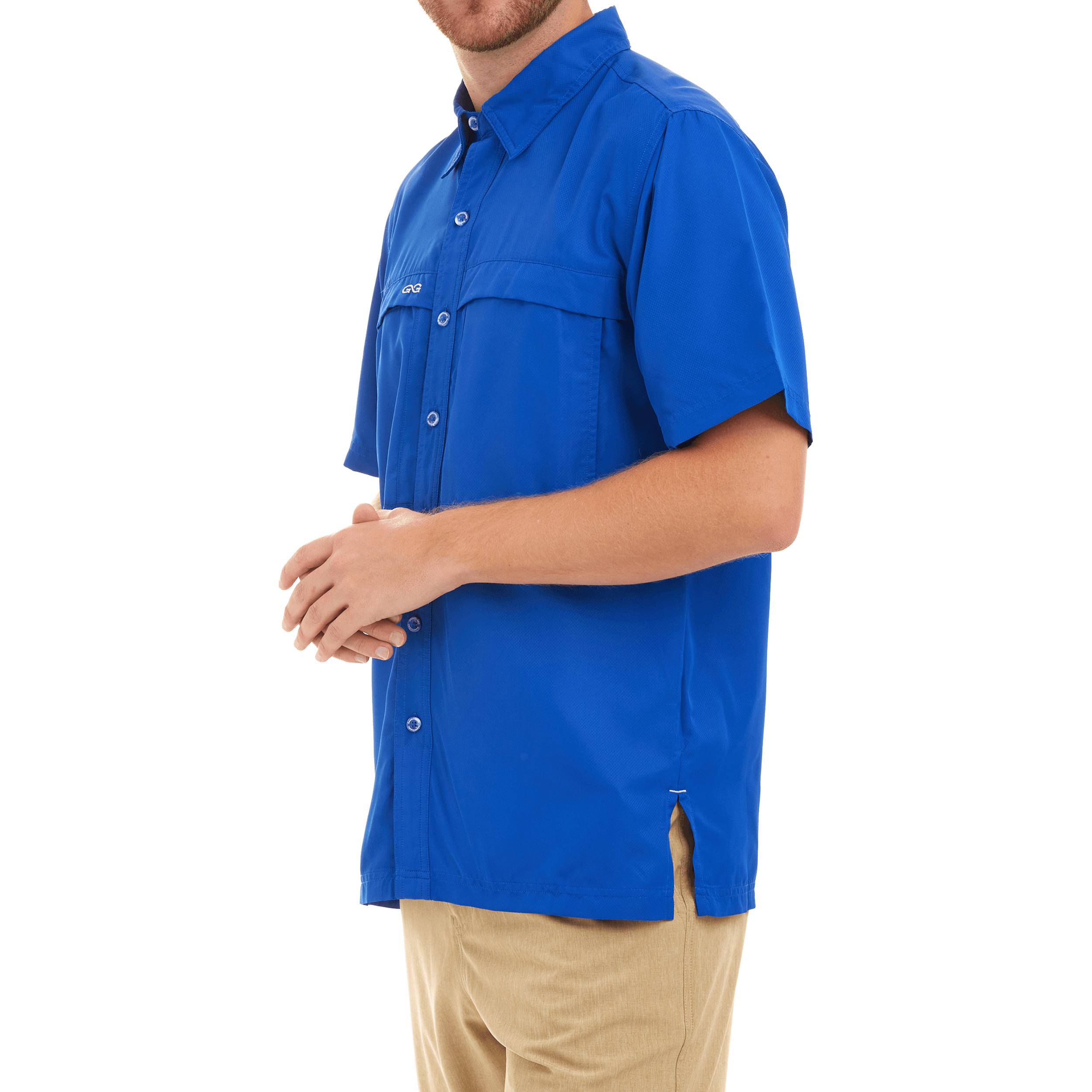 Man wearing a blue shirt with a visible brand logo on a white background