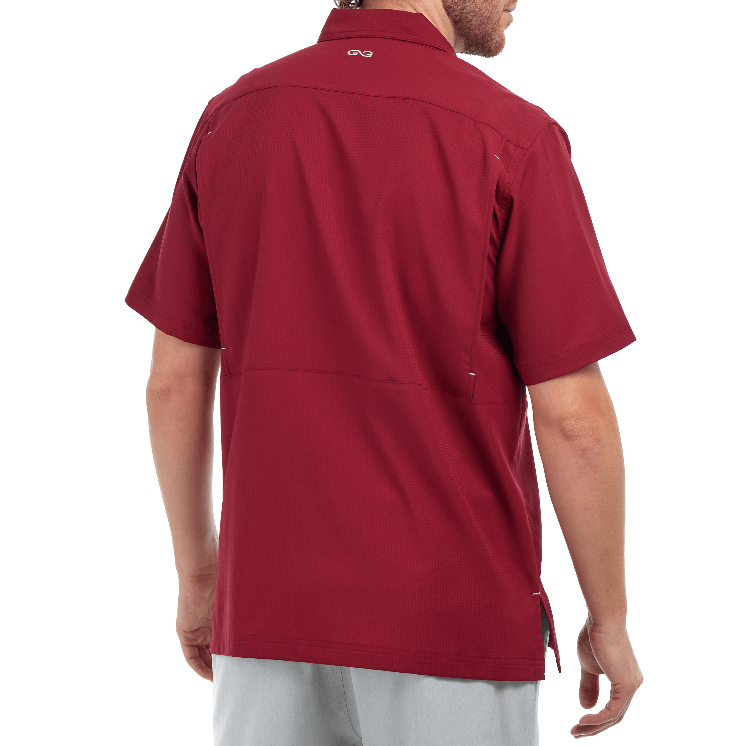 Red short-sleeve shirt worn by a person on a white background
