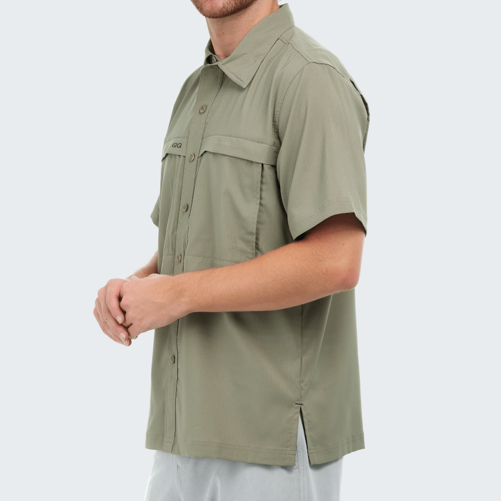Man wearing a green sleeveless shirt on a white background