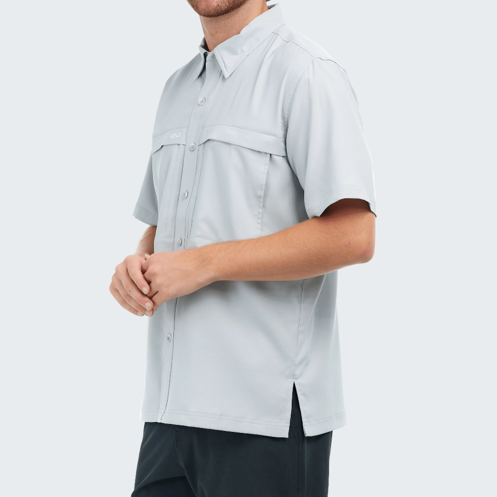 Light gray short-sleeve shirt worn by a person on a white background