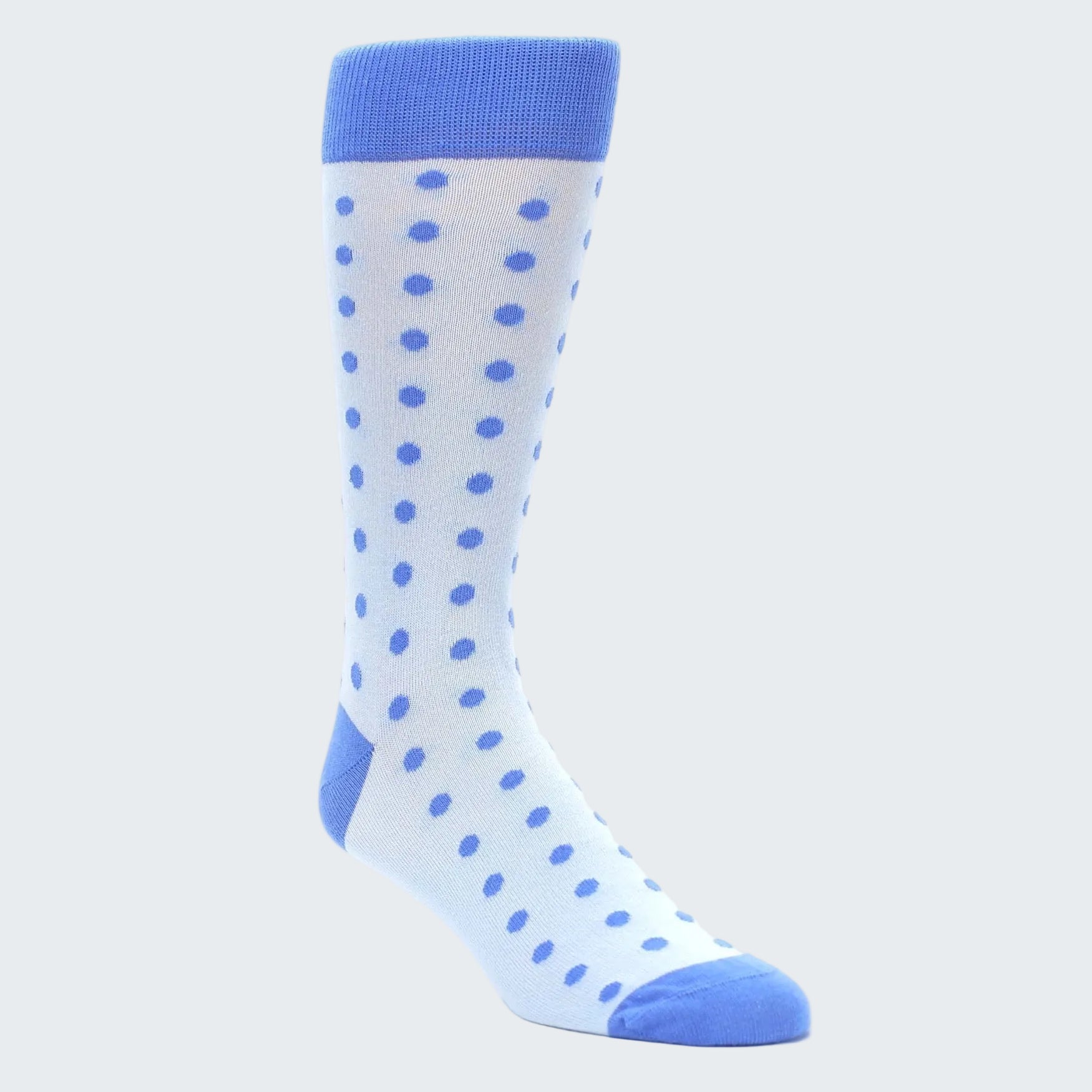 White sock with blue polka dots and cuffs on a white background