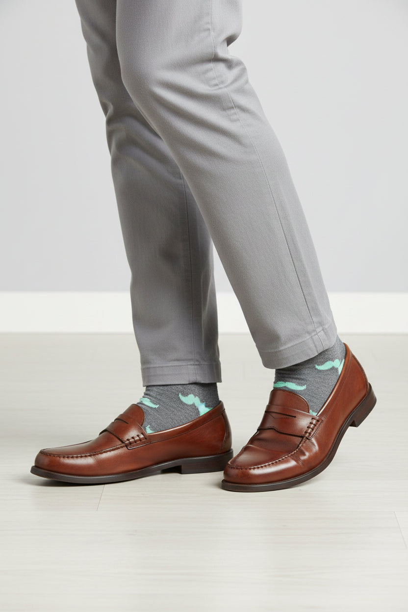 Gray sock with light blue mustache pattern on a white background