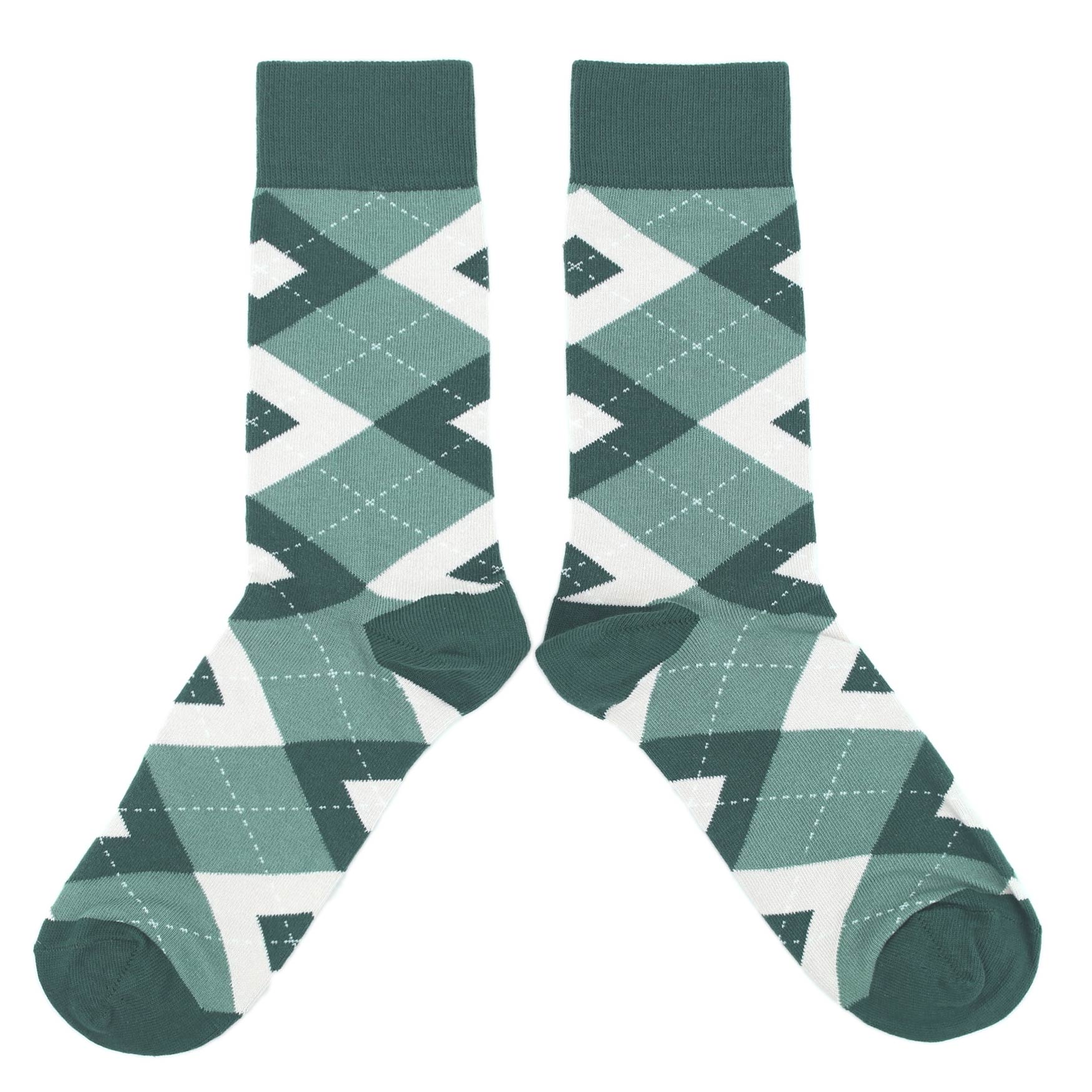 Pair of green and white argyle pattern socks on a white background