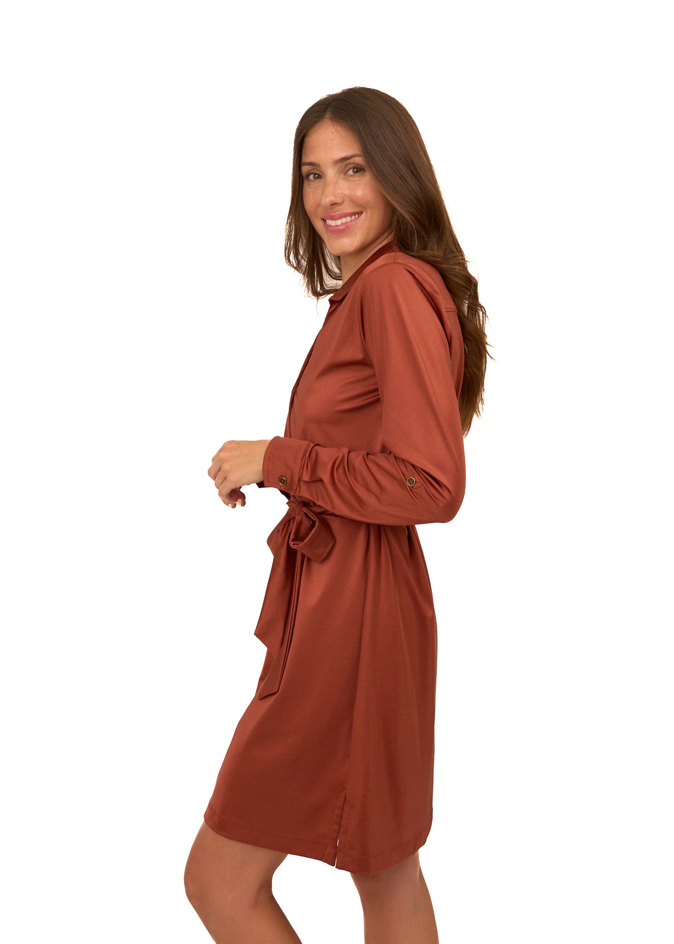 Woman wearing a rust-colored dress on a white background