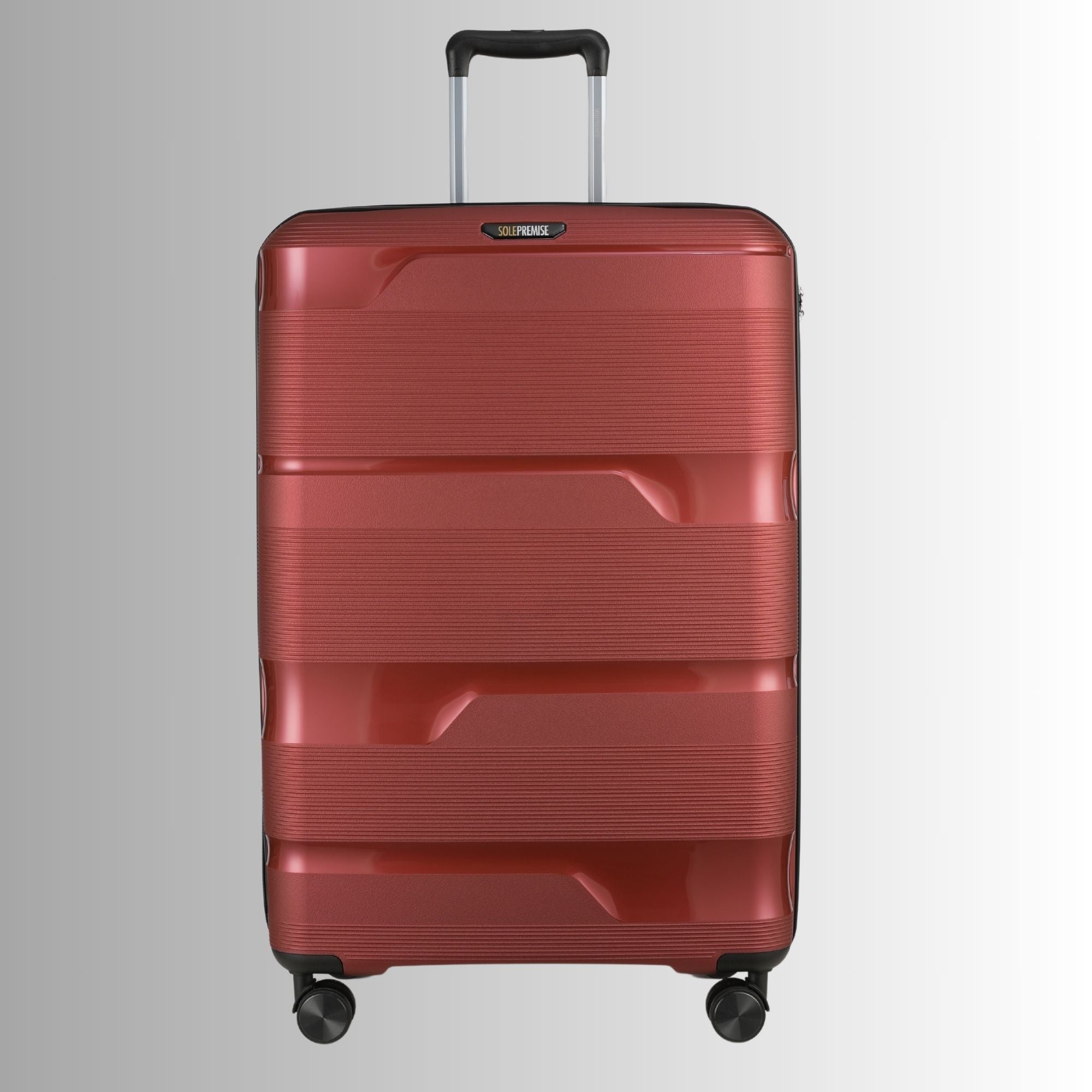 Red suitcase with a textured surface on a light gray background