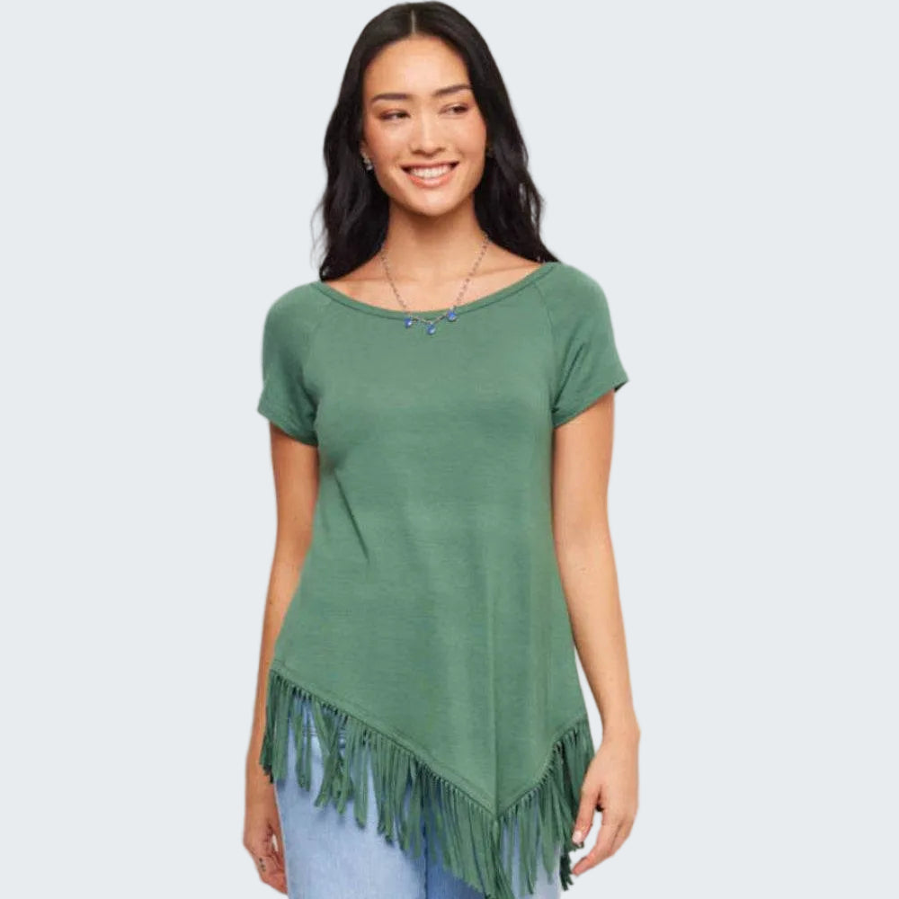 Woman wearing a green fringe top against a white background