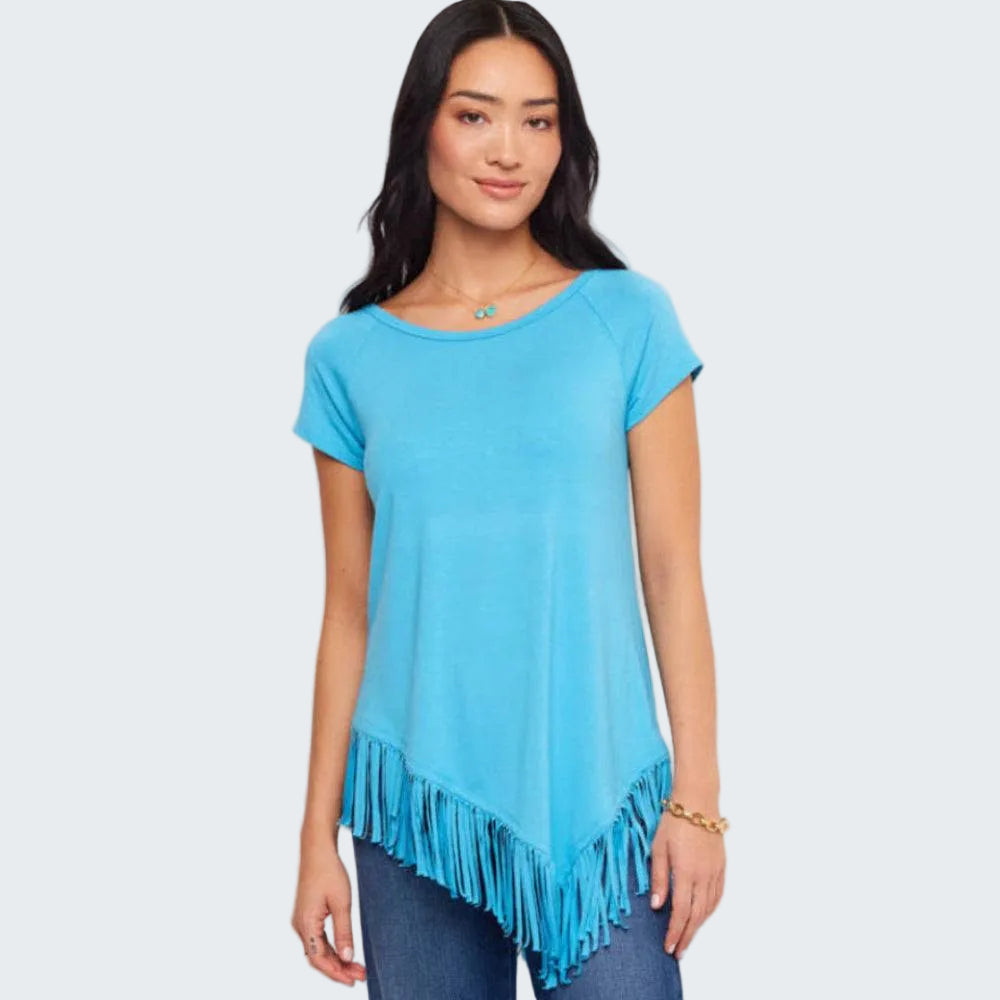 Woman wearing a blue fringed tunic against a white background