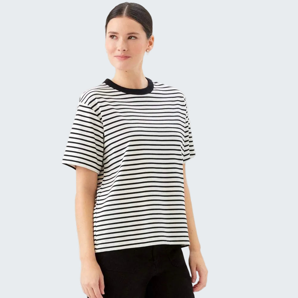 Woman wearing a black and white striped shirt on a white background