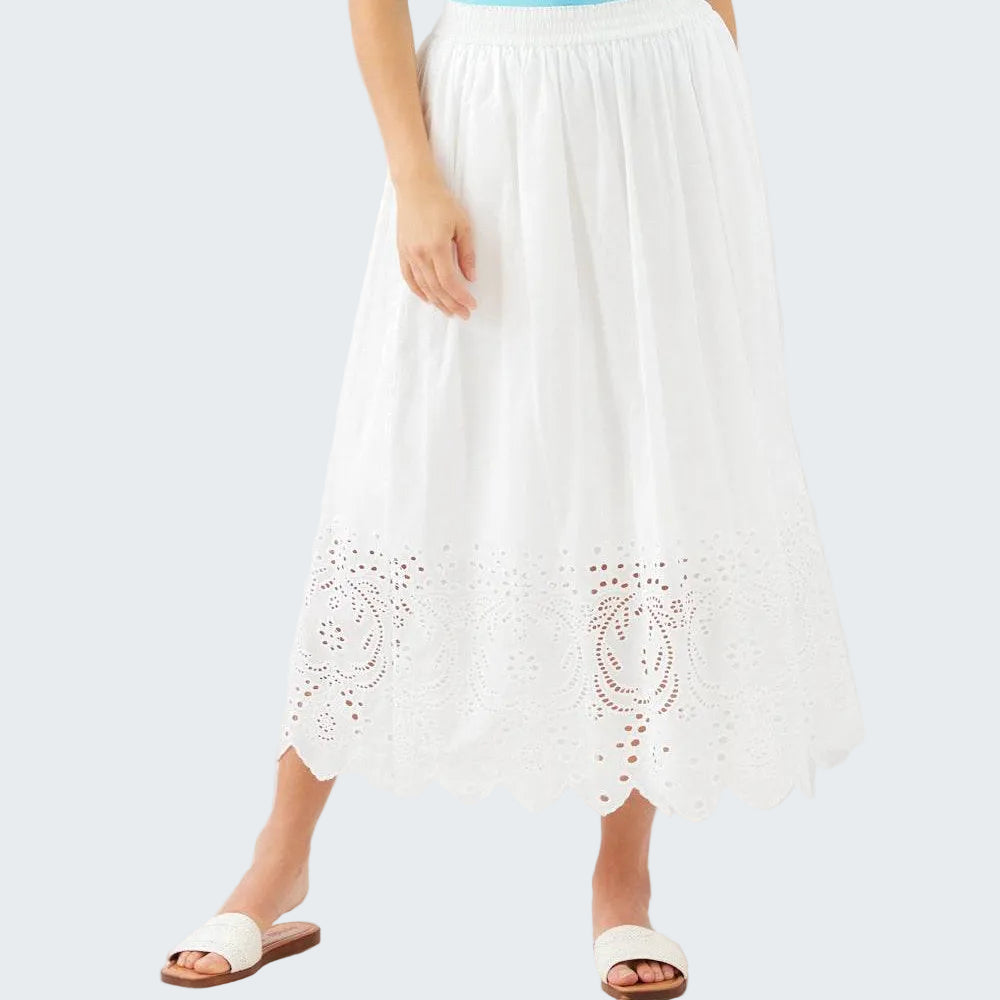White lace-trimmed pants worn by a person on a white background
