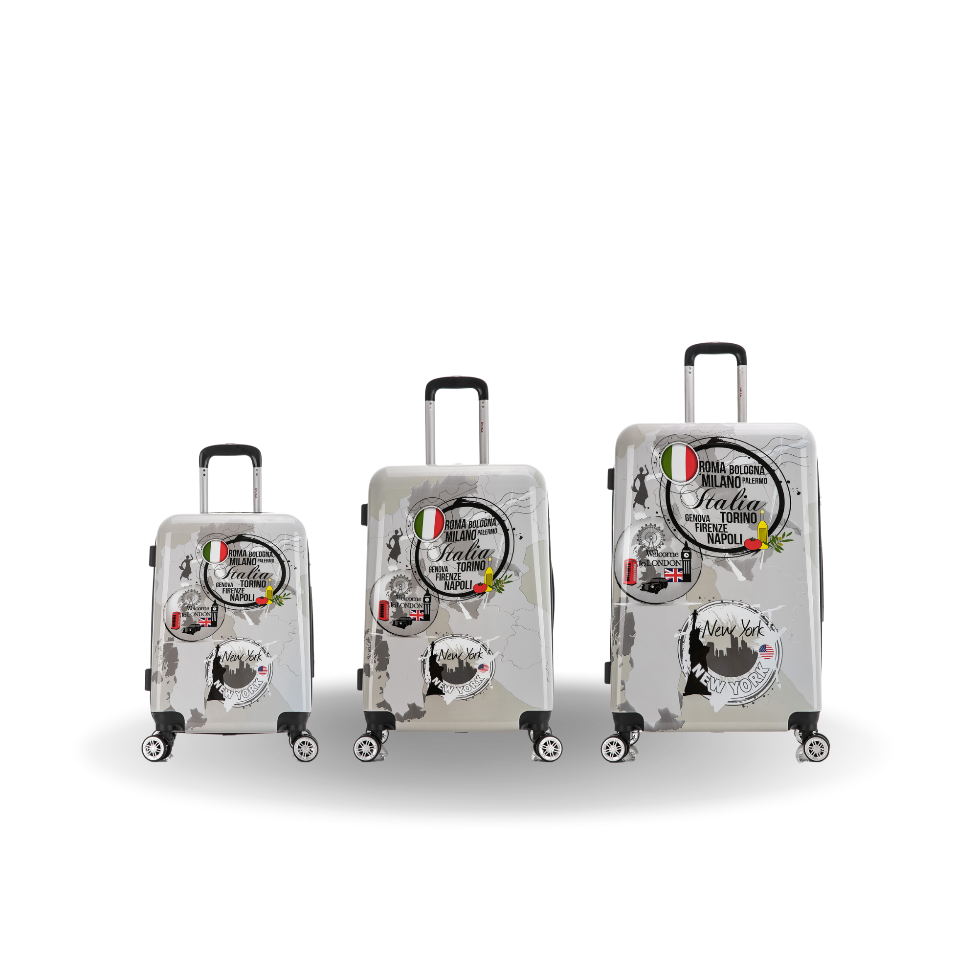Three suitcases of different sizes with decorative labels on a white background