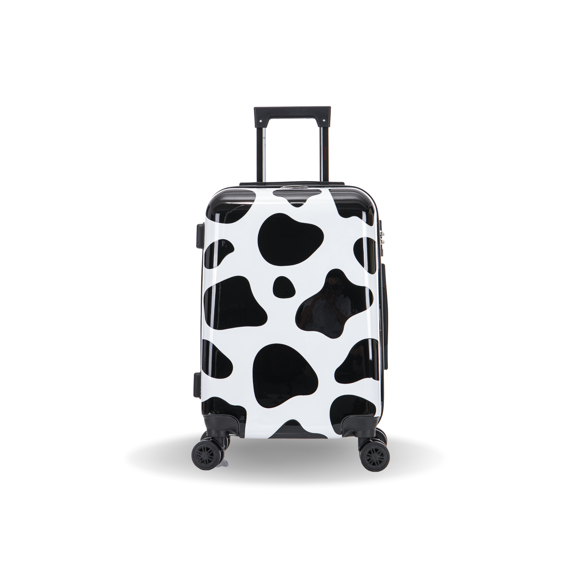 Black and white cow print suitcase on a white background