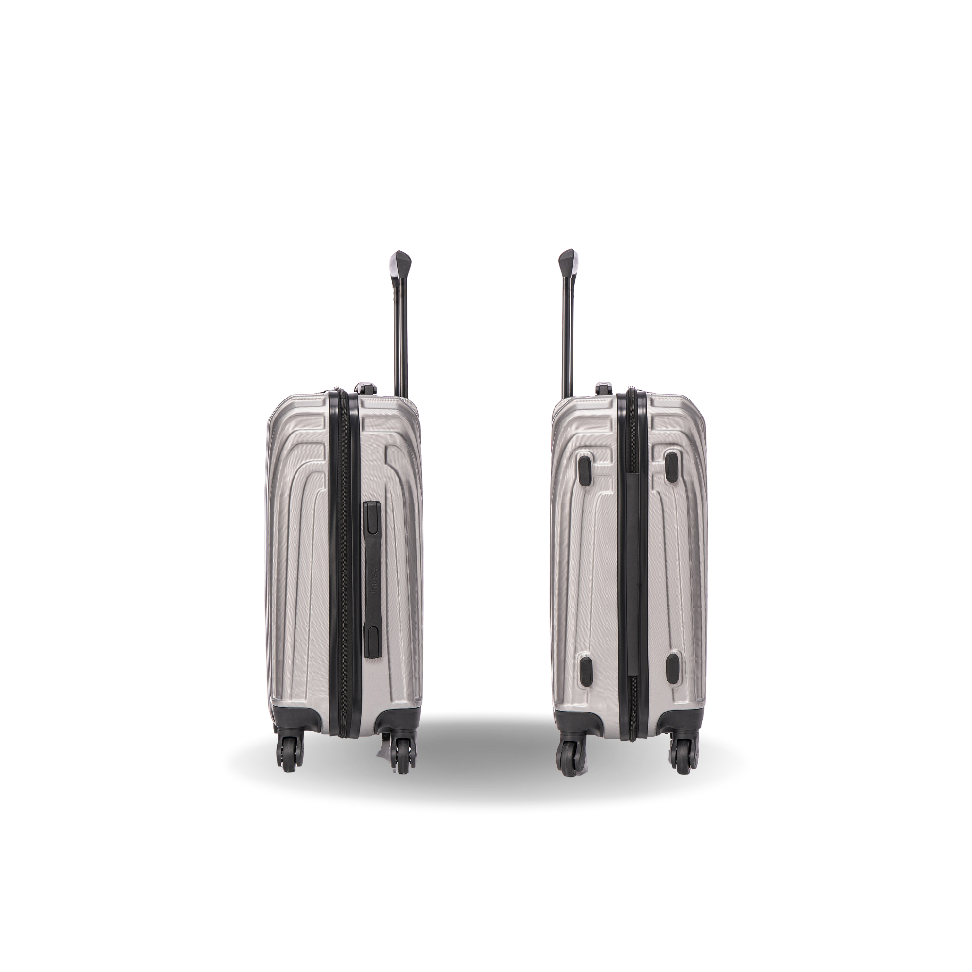 Two silver suitcases with black accents on a white background