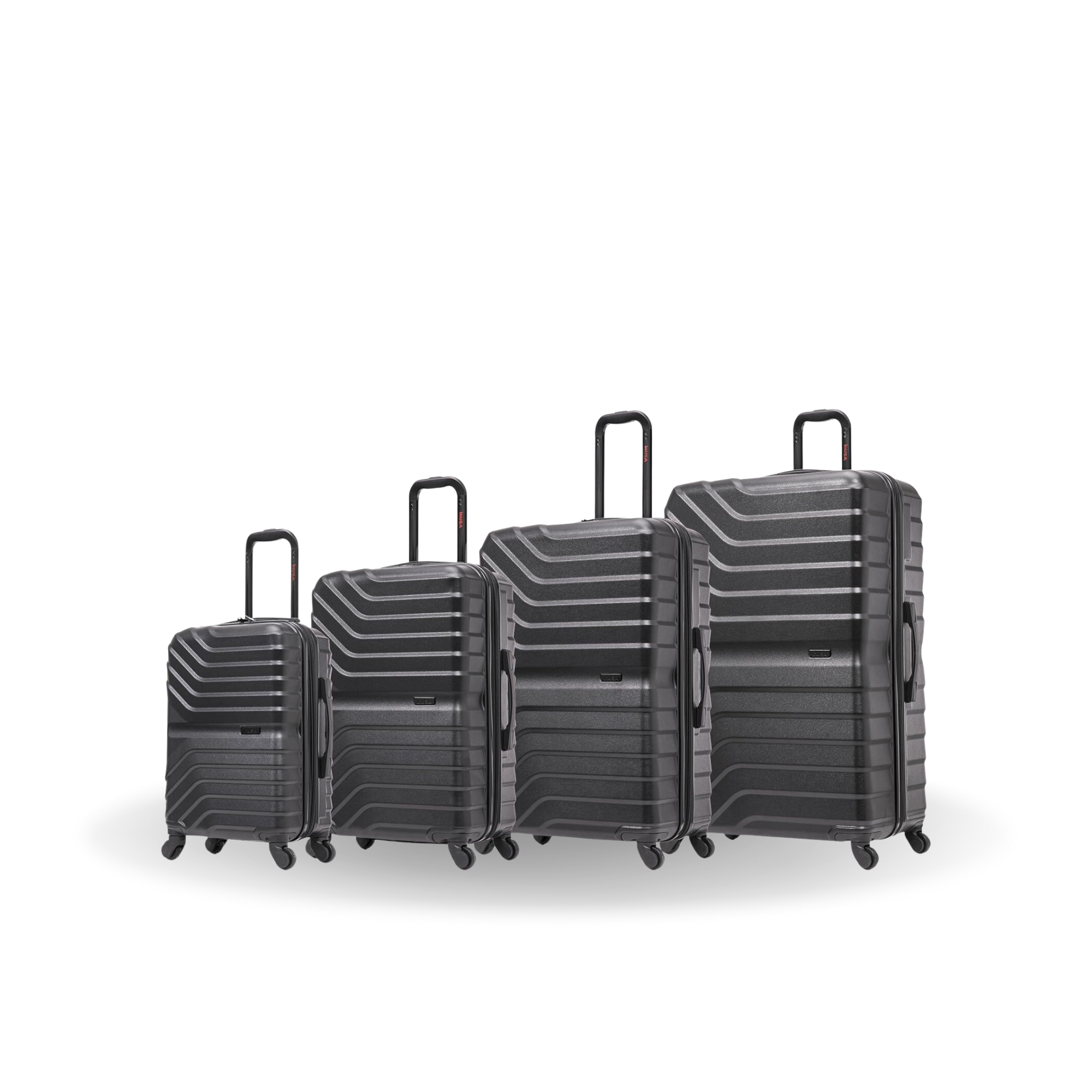 Set of four black suitcases of different sizes on a white background