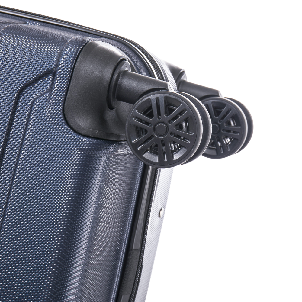 Close-up of a blue suitcase with black wheels on a white background