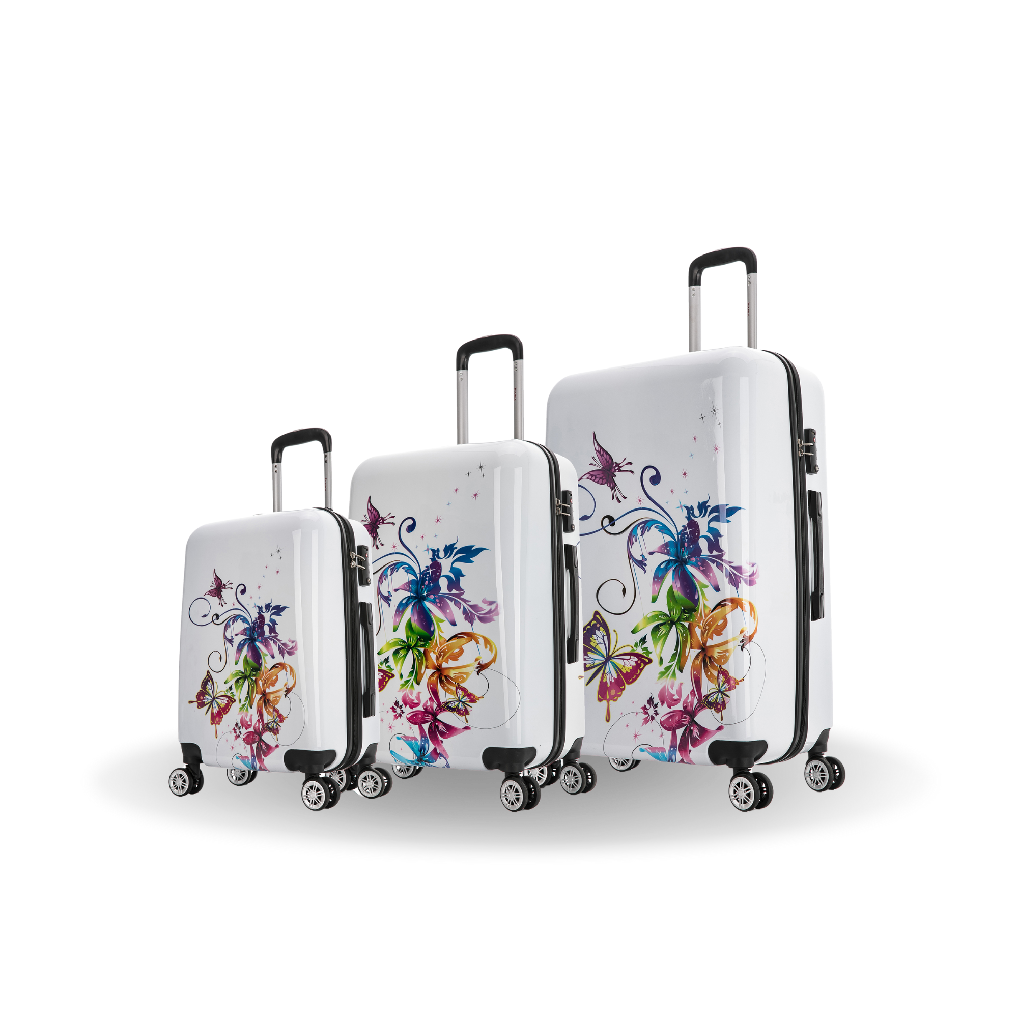 Set of three white suitcases with colorful floral designs on a white background