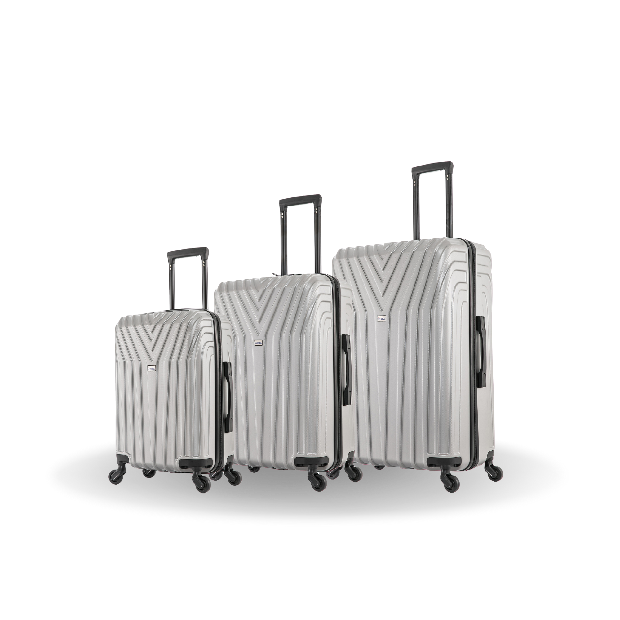 Set of three silver suitcases with black handles and wheels on a white background