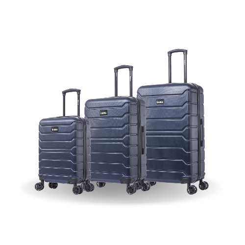Set of three navy blue suitcases of different sizes on a white background