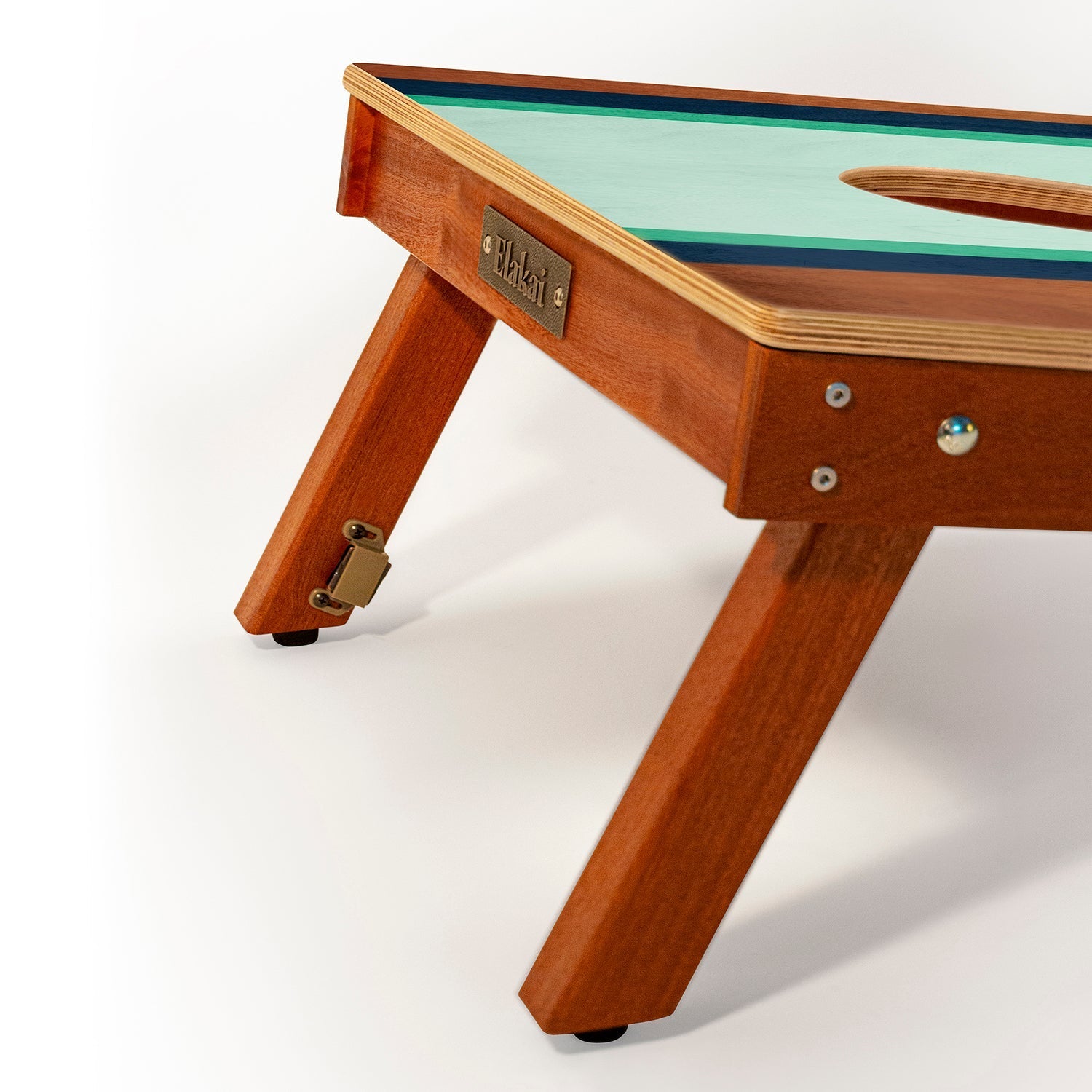 Wooden children's table with green top on a white background