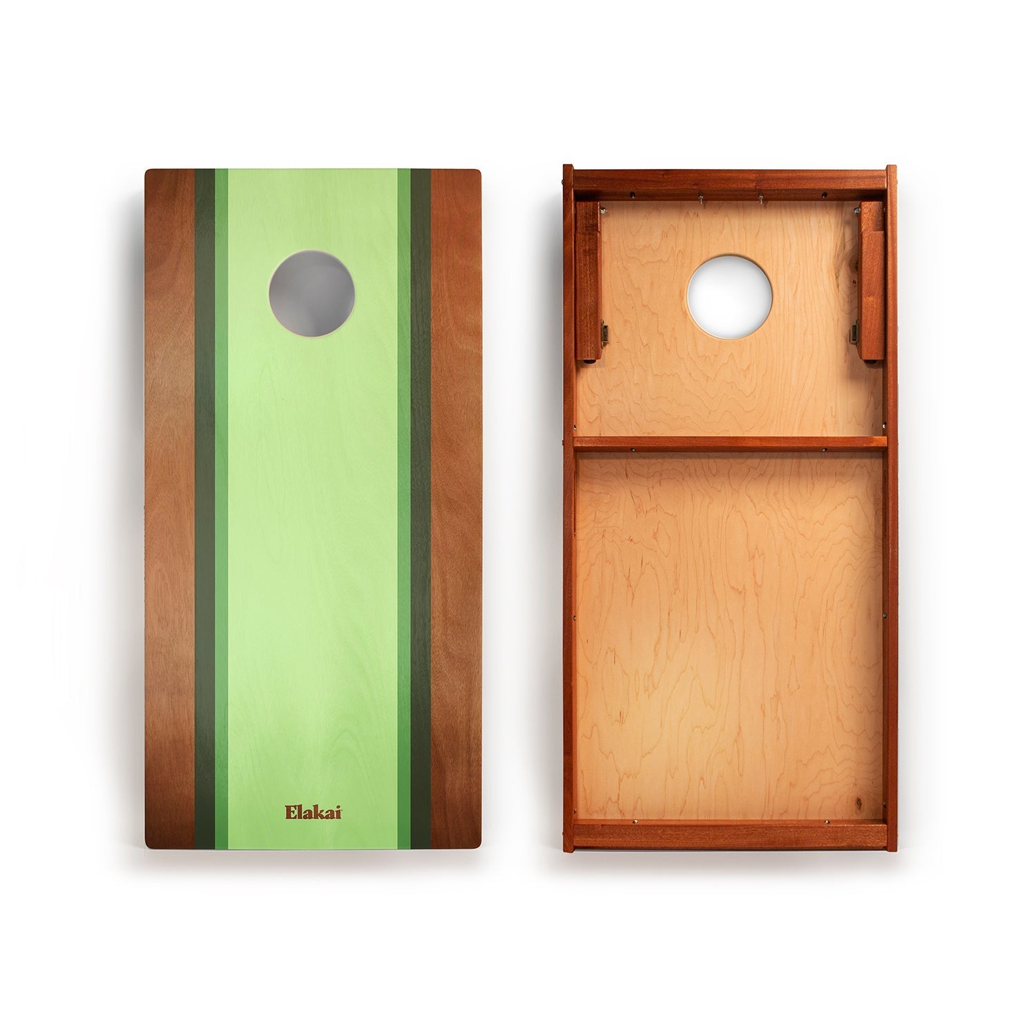 Wooden cornhole boards with green and brown design on a white background