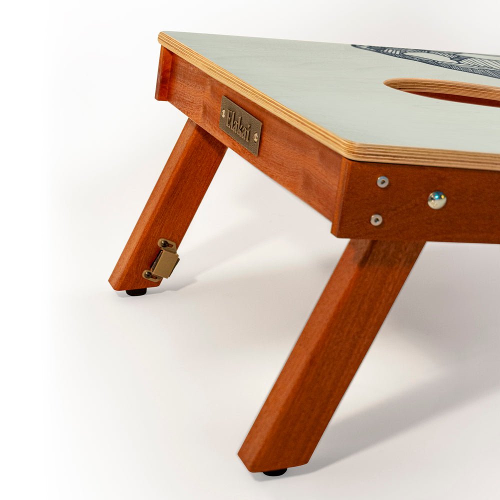 Wooden table with a white surface on a white background
