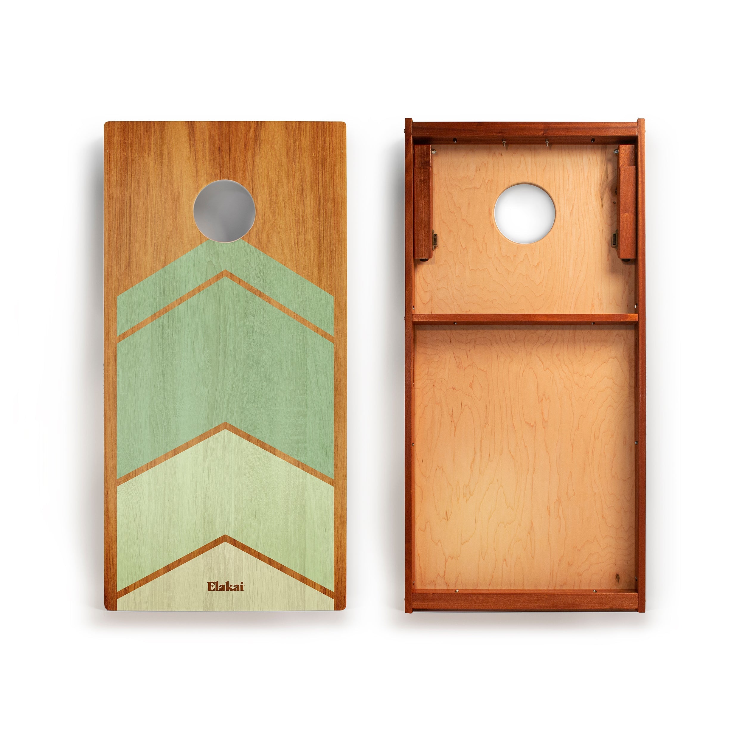 Wooden cornhole boards with green and brown design on a white background