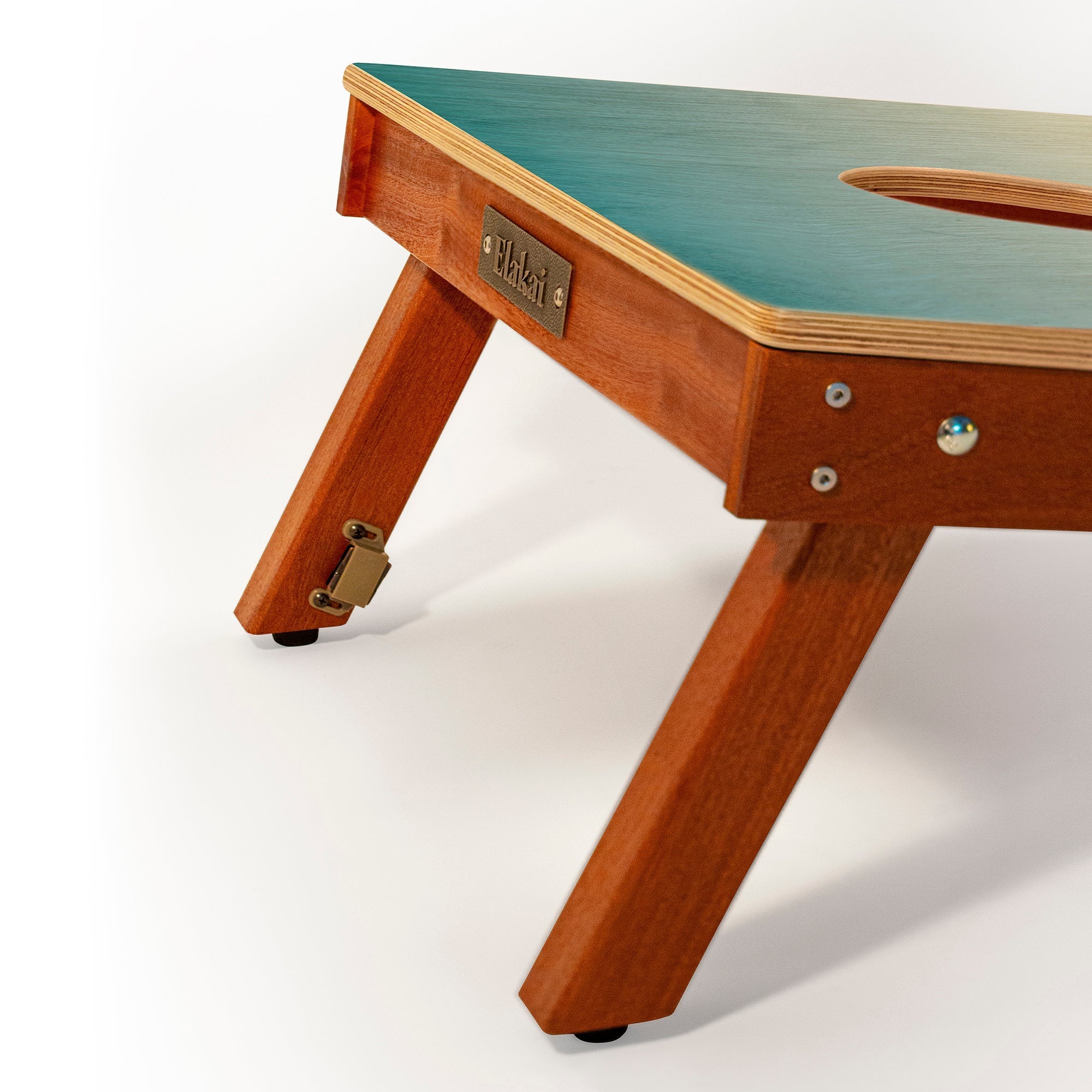 Wooden pet table with green top on a white background