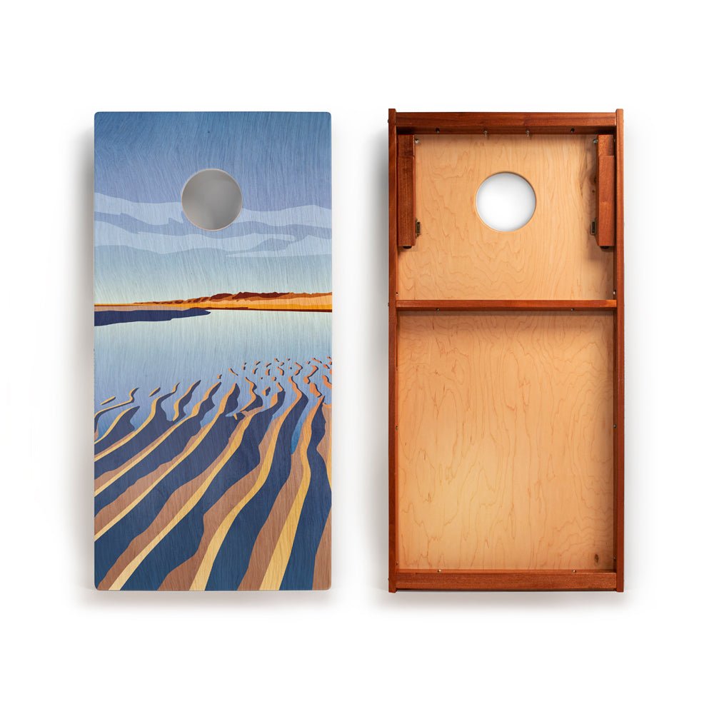 Wooden cornhole board with beach scene design on one side and plain wood on the other