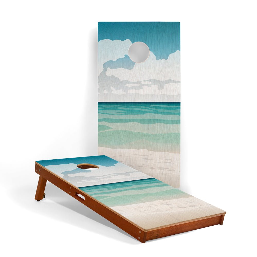 Wooden bean bag toss game with beach-themed design on a white background