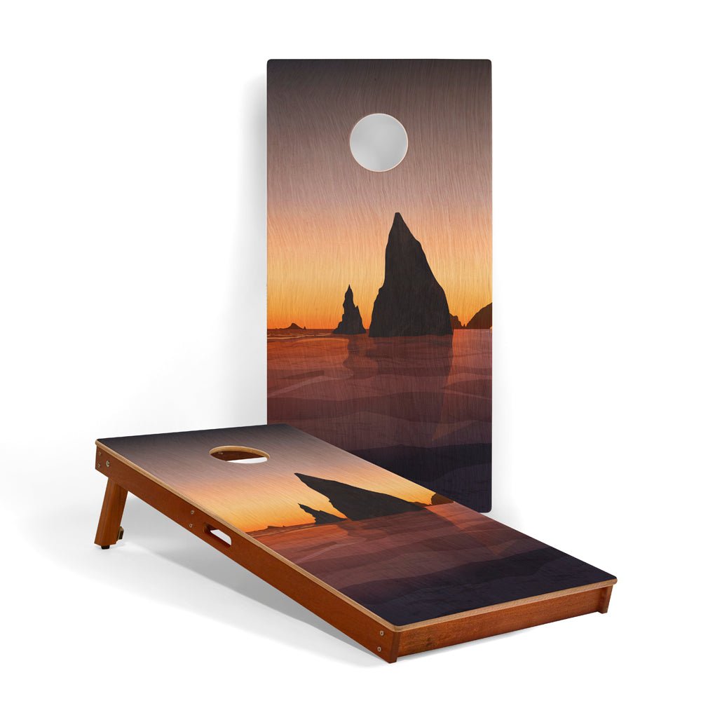 Cornhole boards with a sunset design featuring cliffs and a moon on a white background