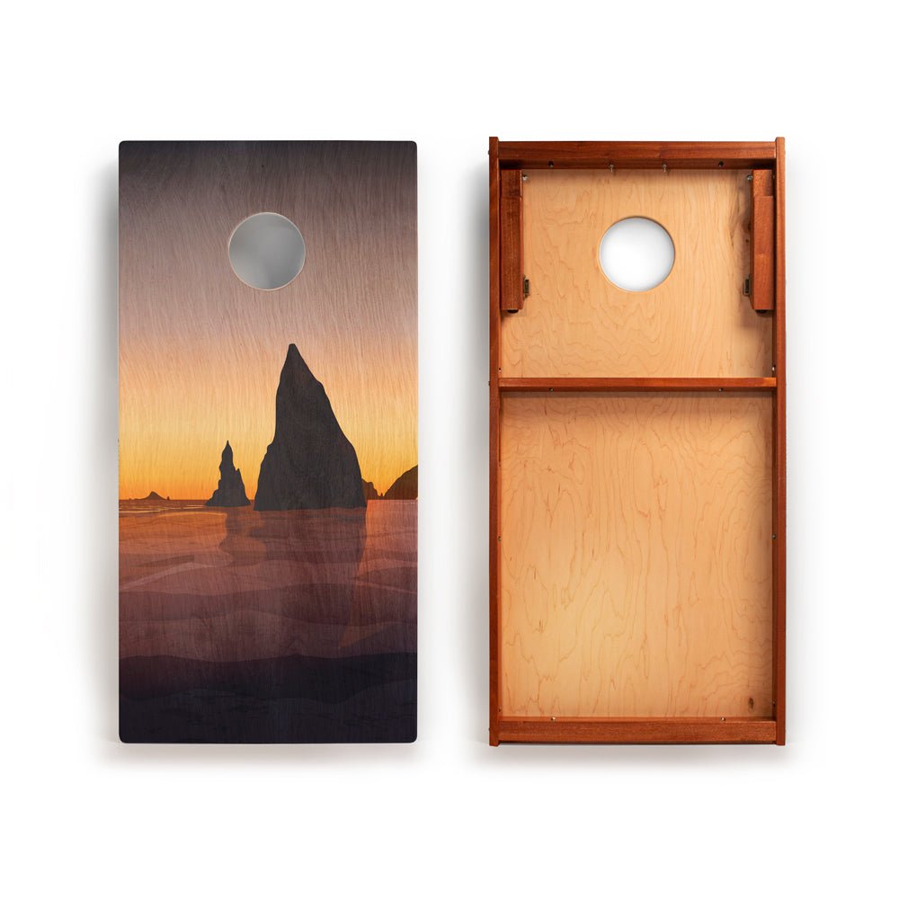 Wooden cornhole board with sunset design on one side and plain wood on the other