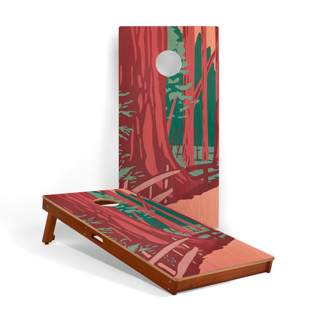Cornhole board with forest design on a white background