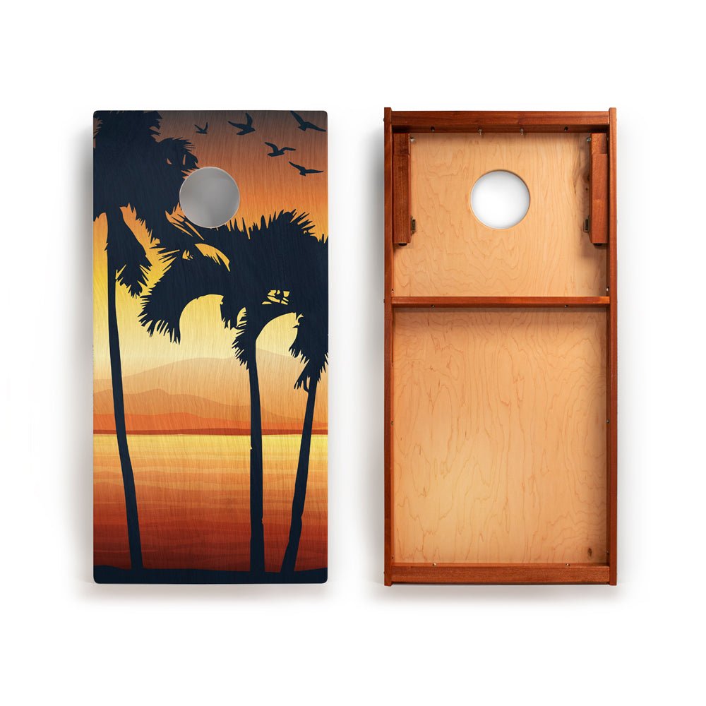 Cornhole board with palm tree design on one side and plain wood texture on the other.