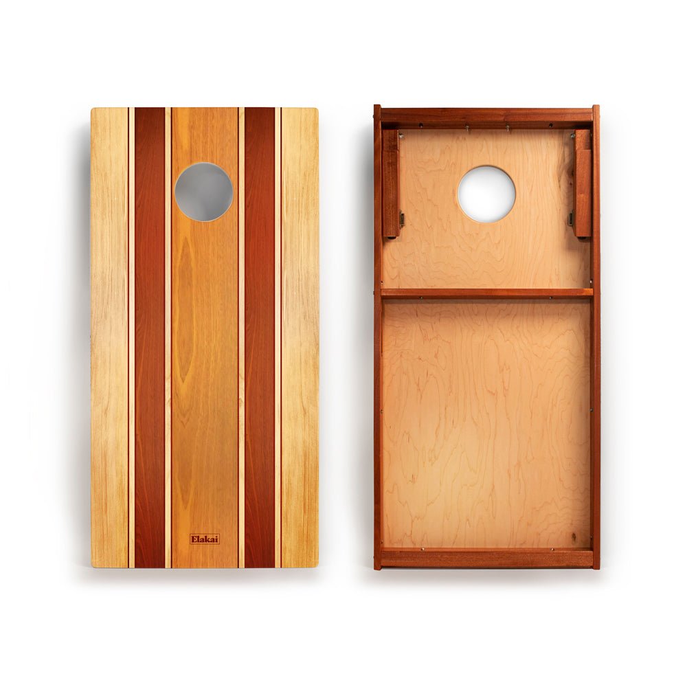 Wooden cornhole boards with a striped design on a white background