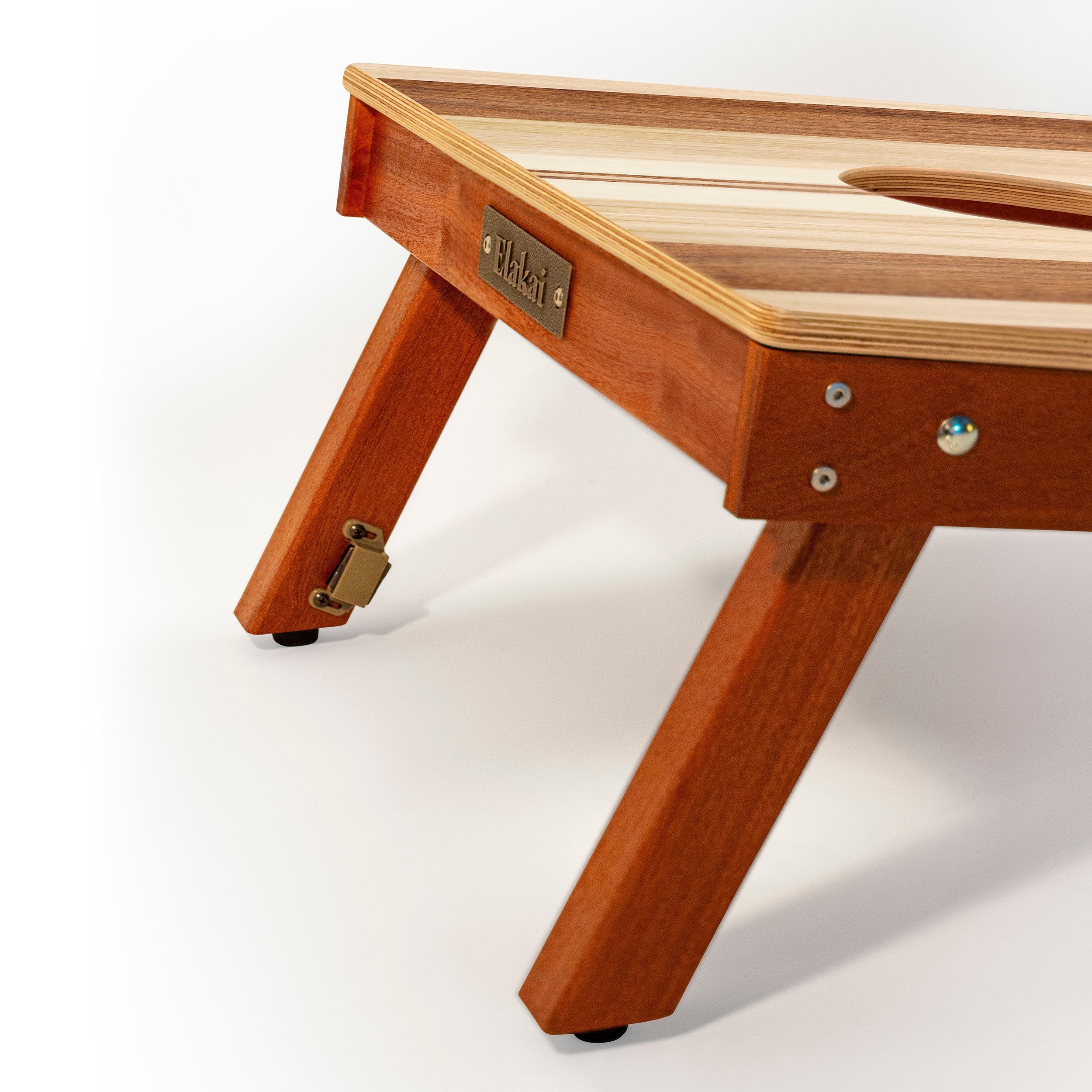 Wooden pet bed with a brand name tag on a white background