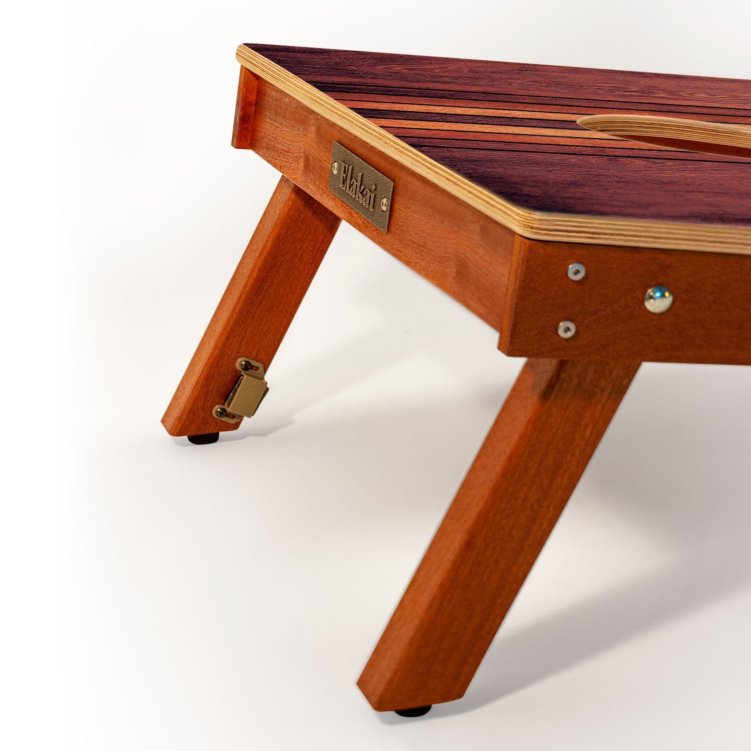 Wooden pet bed with a brand name tag on a white background