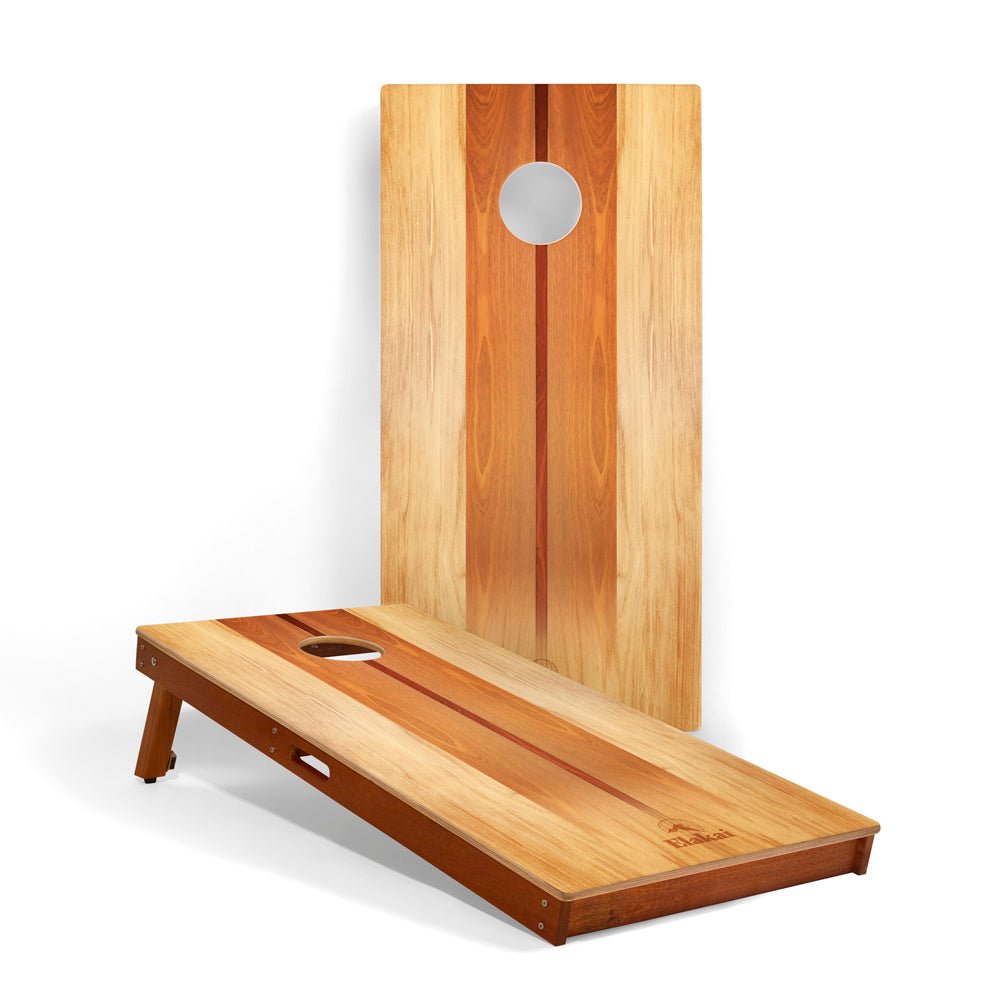 Wooden cornhole board with a white background