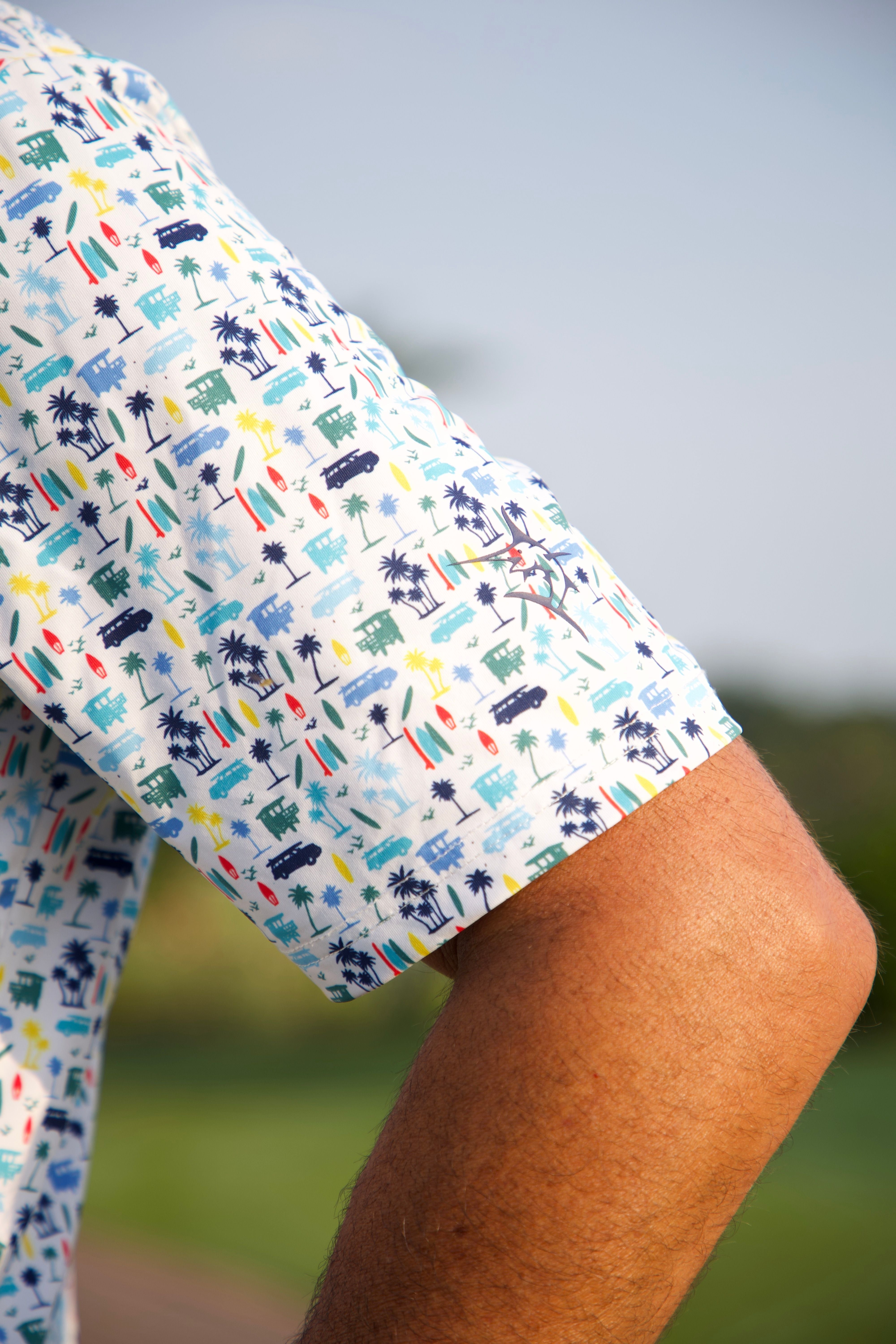Close-up of a person wearing a patterned shirt with a blurred background