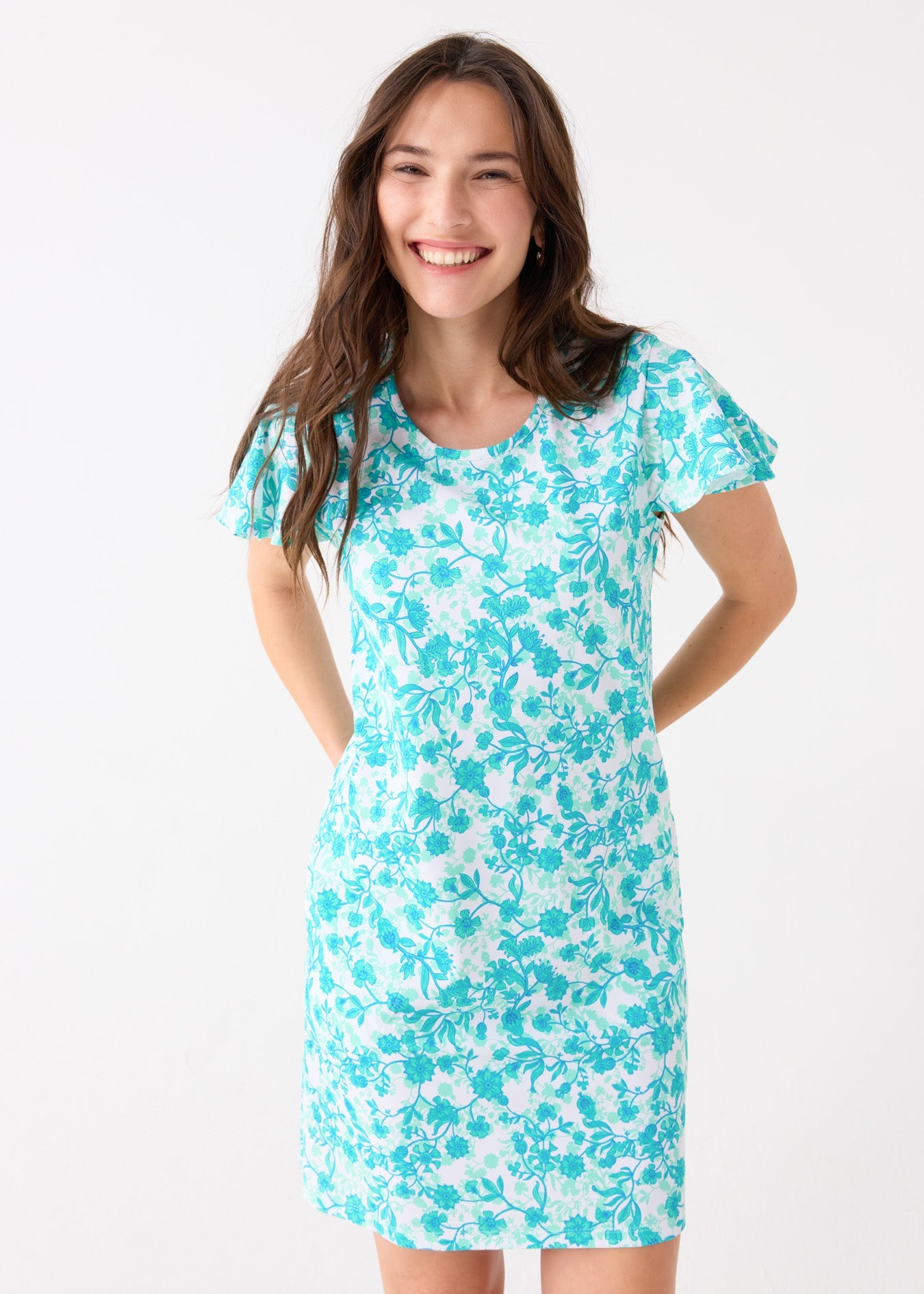 Woman wearing a blue floral dress on a white background