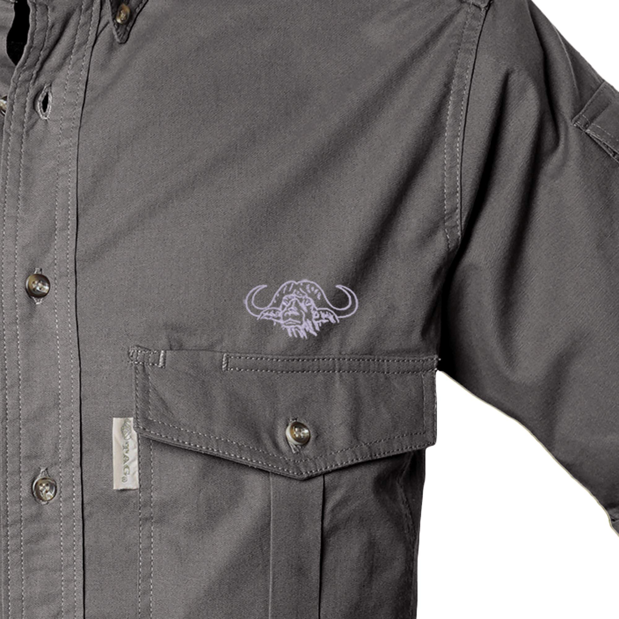 Close-up of a dark gray jacket with a logo on the chest pocket against a white background
