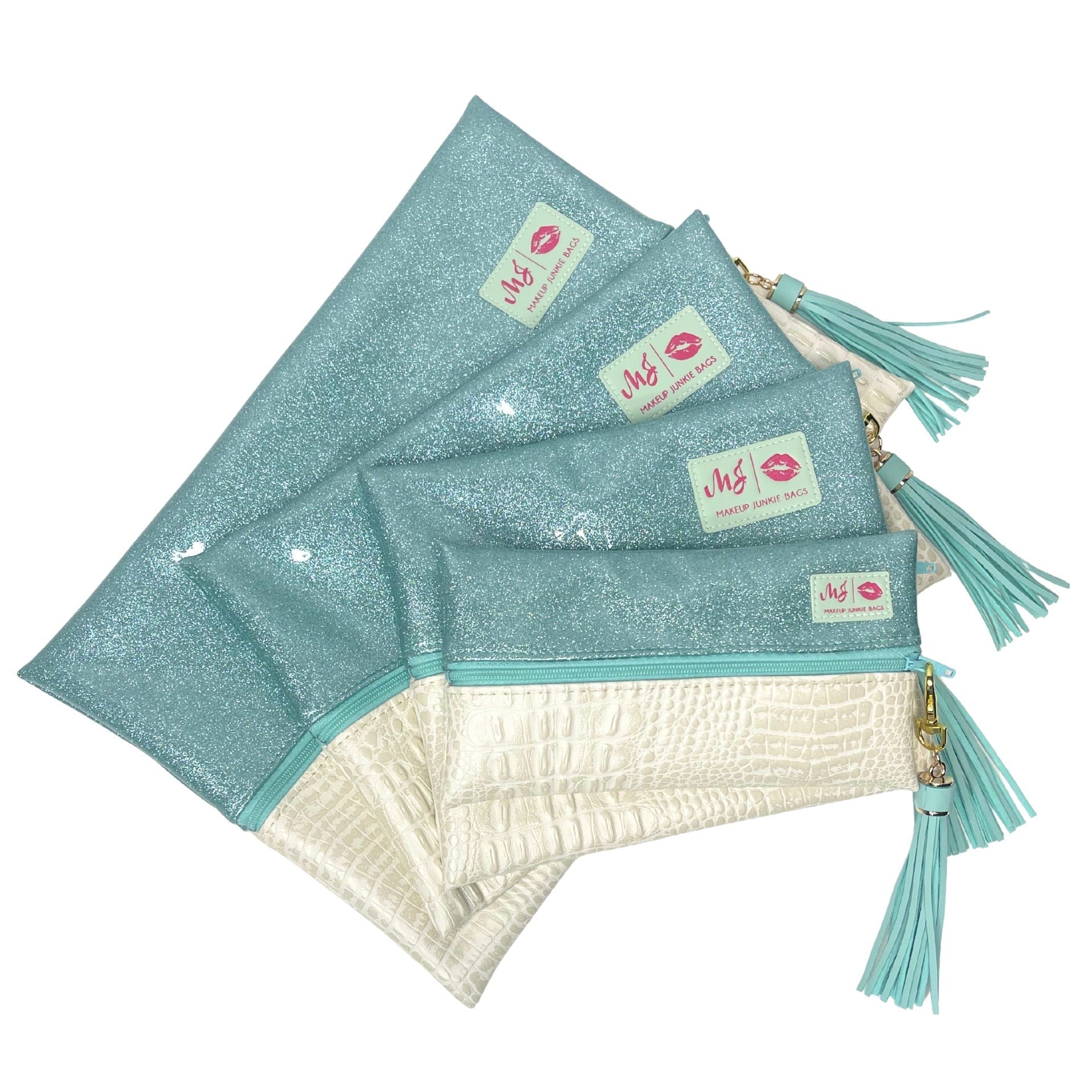Set of glittery teal pouches with tassels on a white background
